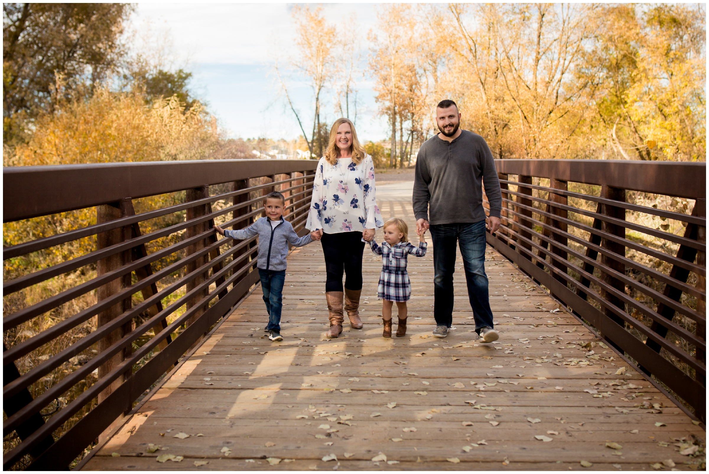 family walking on bridge at Longmont family photography session 