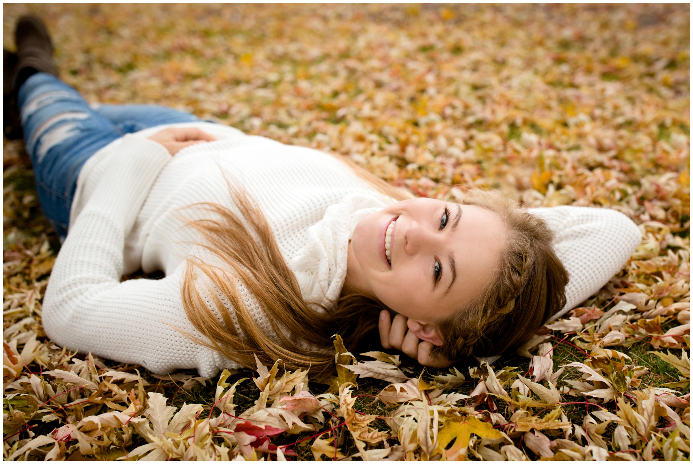 teen girl laying in leaves at fall Niwot photos by Lyons Colorado portrait photographer Plum Pretty Photography