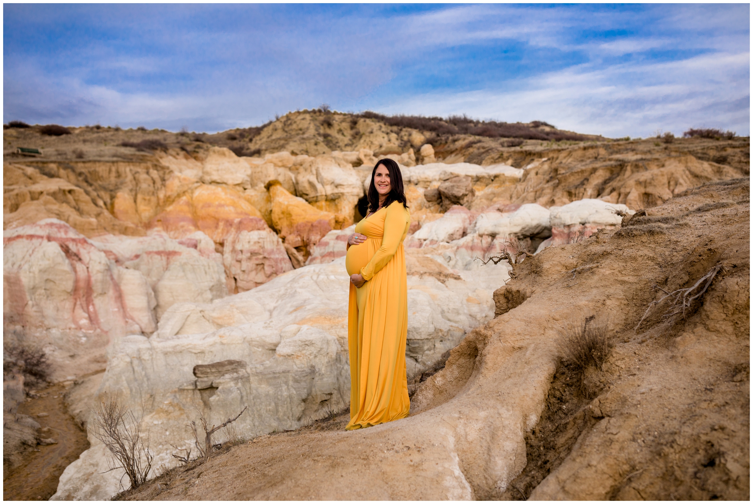 pregnant woman in yellow maternity gown at Colorado Paint Mines maternity photography session 