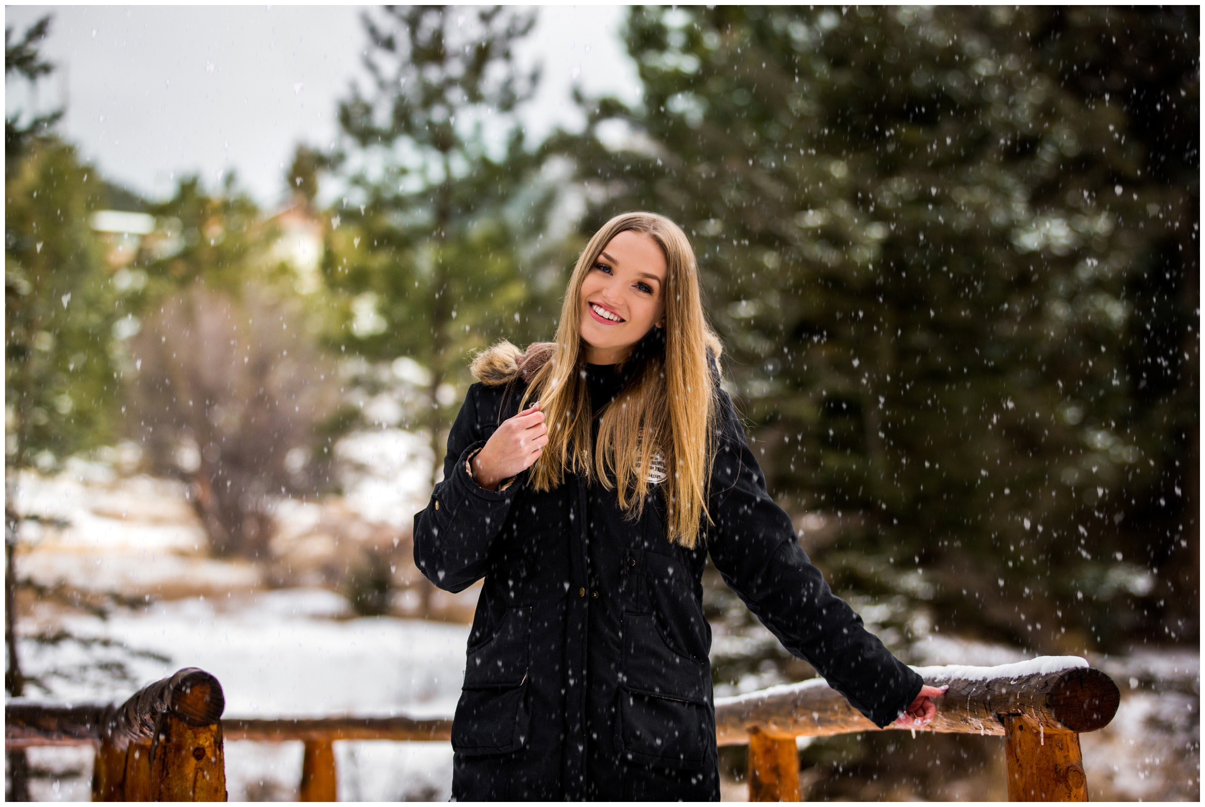 teen girl posing on bridge with snow all around during Estes Park Colorado senior pictures 