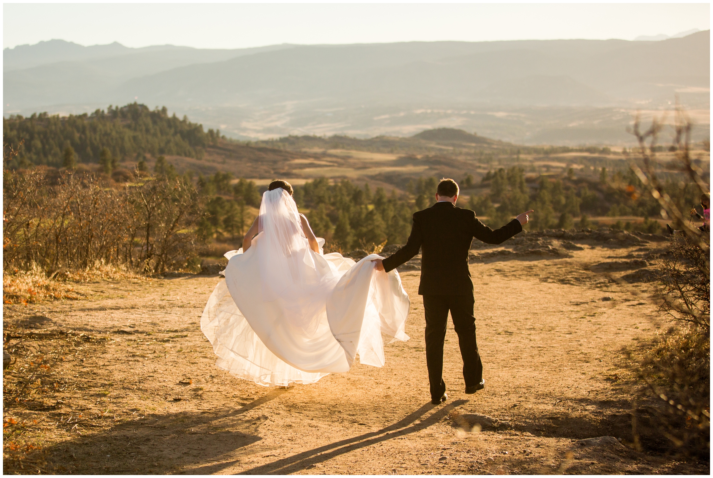 bride and groom walking through Daniels Park Sedalia Colorado