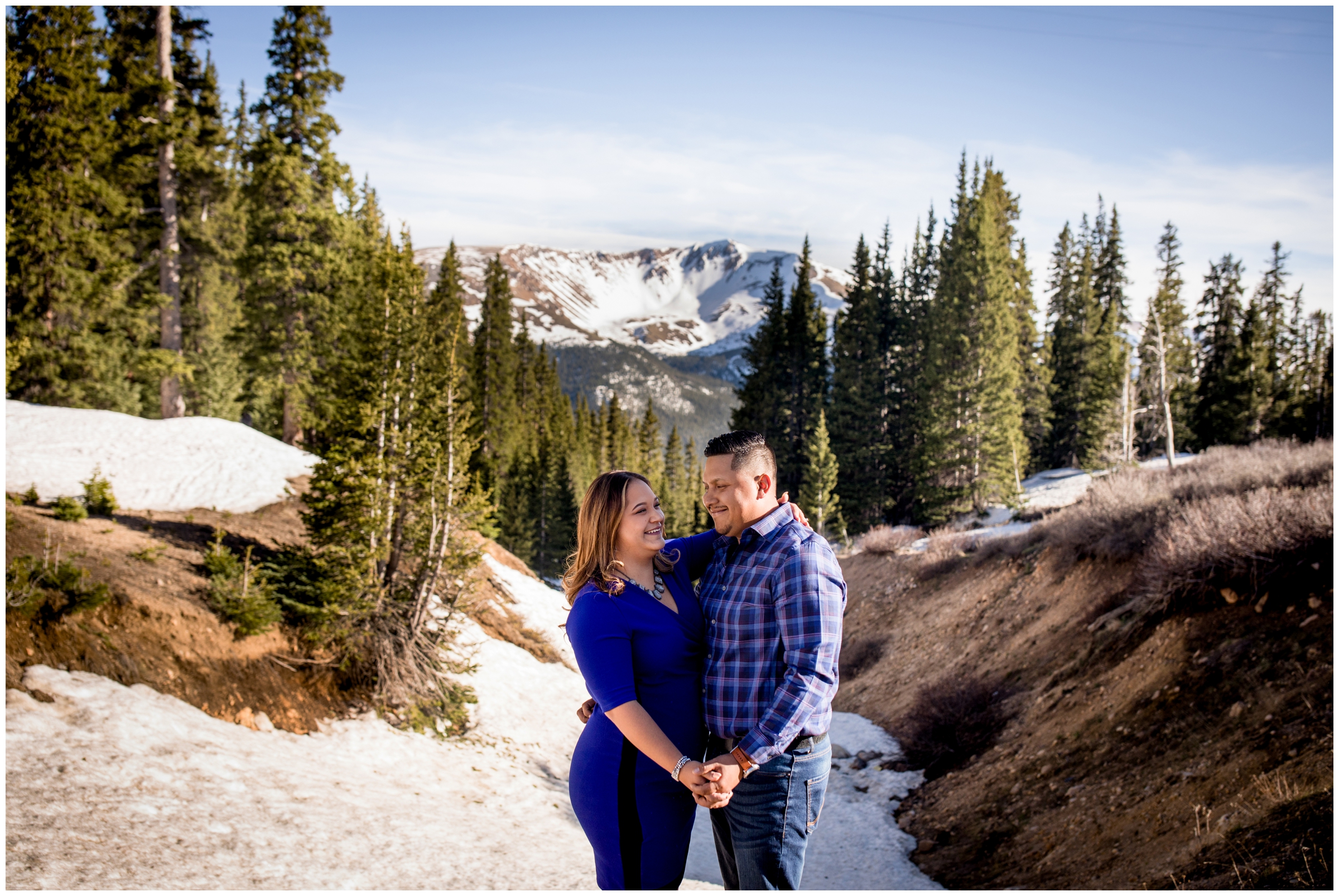 couple posing on Berthoud Pass during Winter Park engagement portraits 