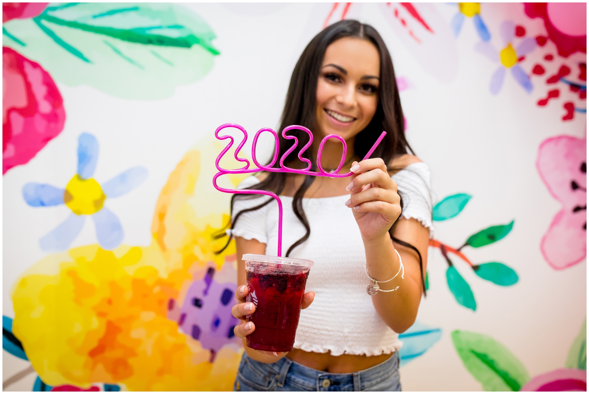 teen posing with swirly straw during unique Longmont senior pictures 