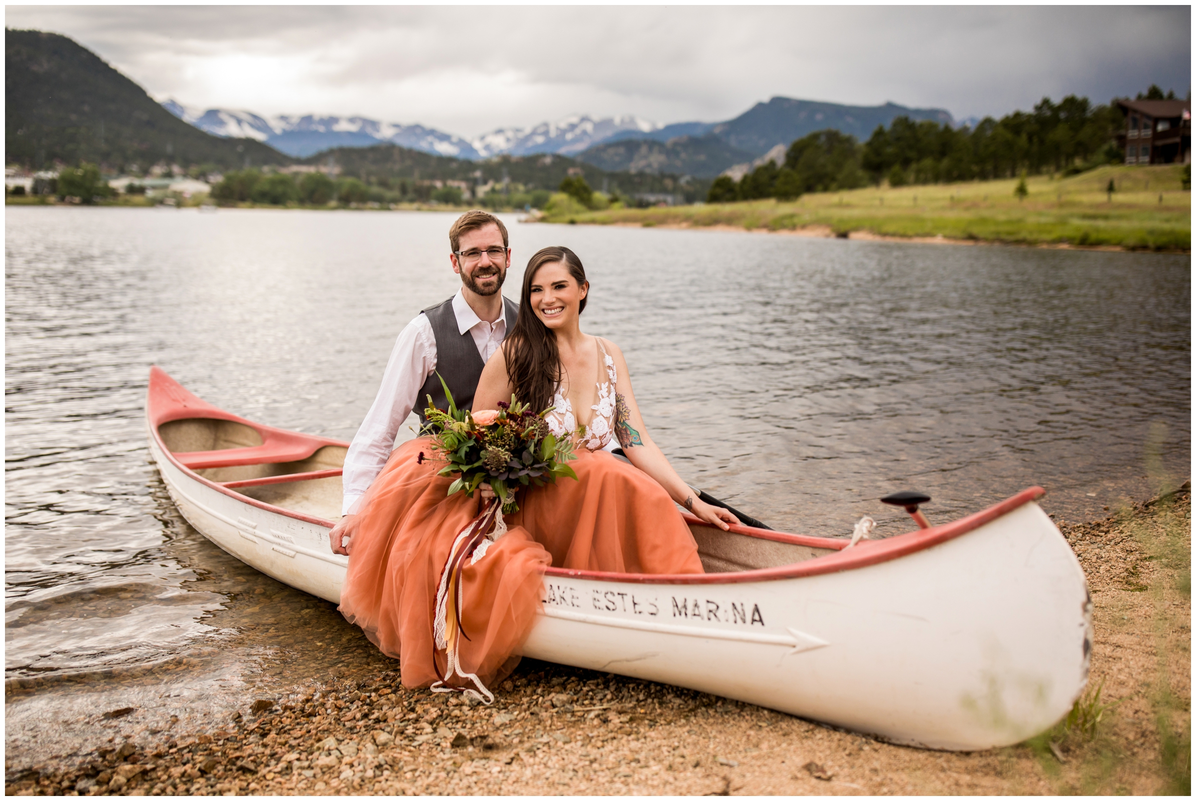 couple sitting in a canoe during Colorado lake engagement photos 