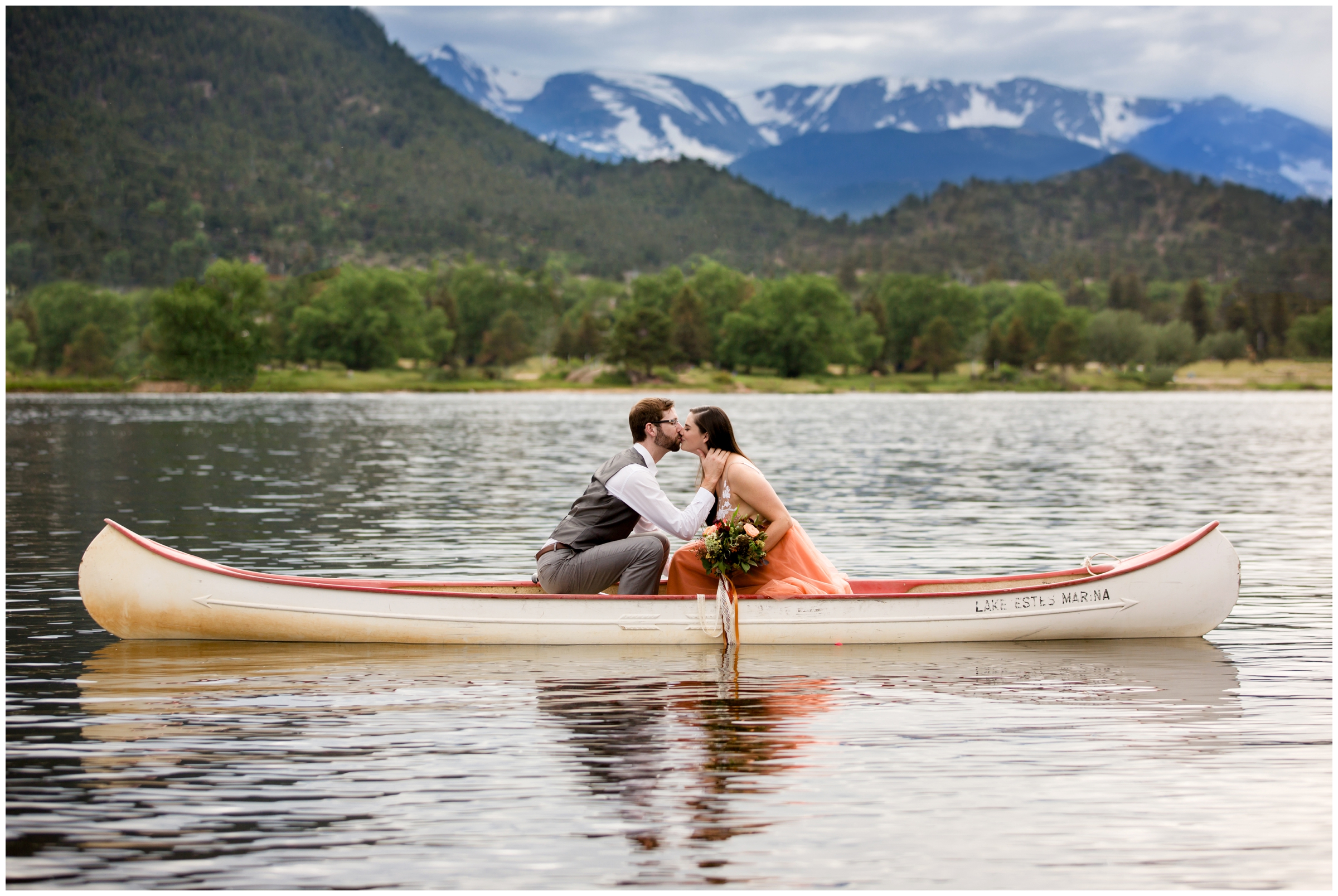 couple kissing in a canoe during Colorado intimate wedding by Estes Park elopement photographer Plum Pretty Photography