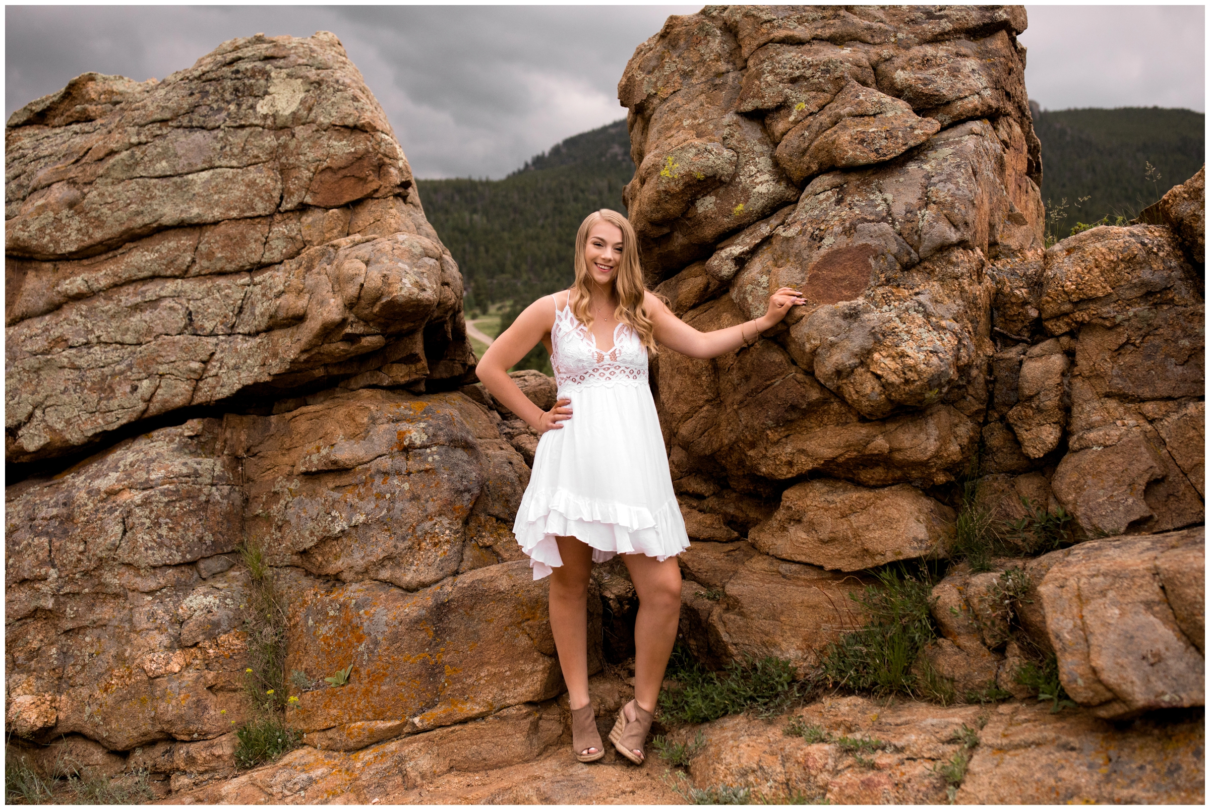 teen girl posing on rocks during Estes Park senior portraits 