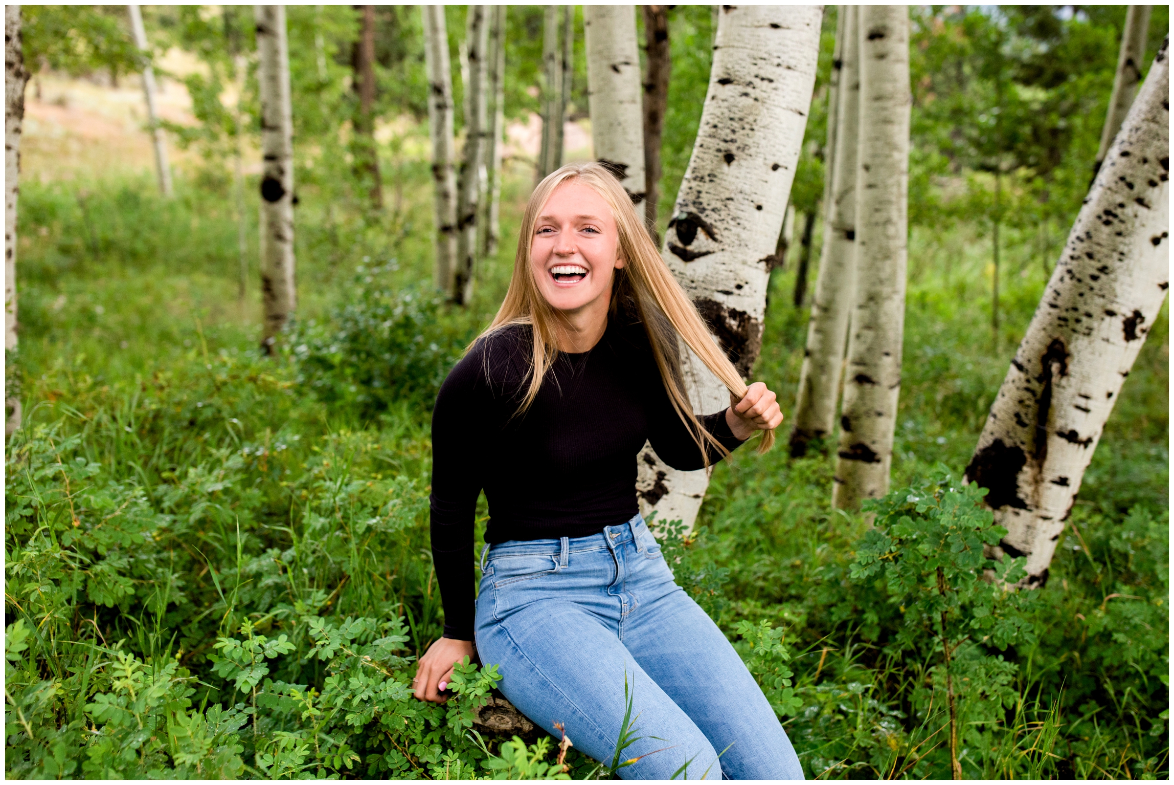 teen laughing in aspen grove during Boulder Colorado senior portraits 