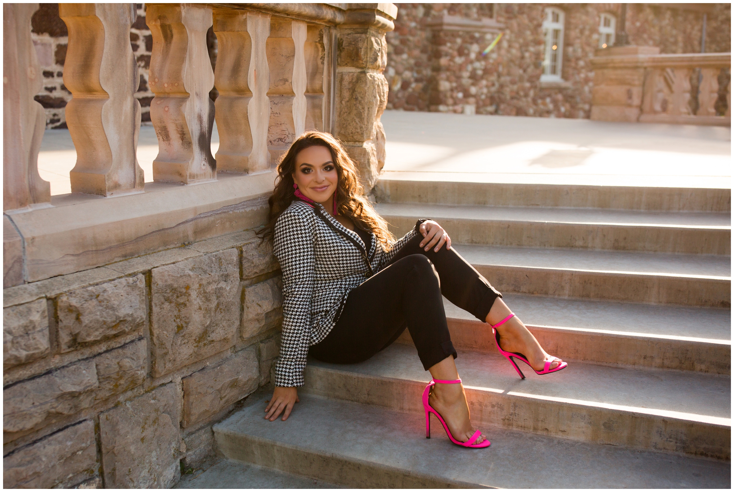 teen with hot pink heels during Colorado senior photography session 
