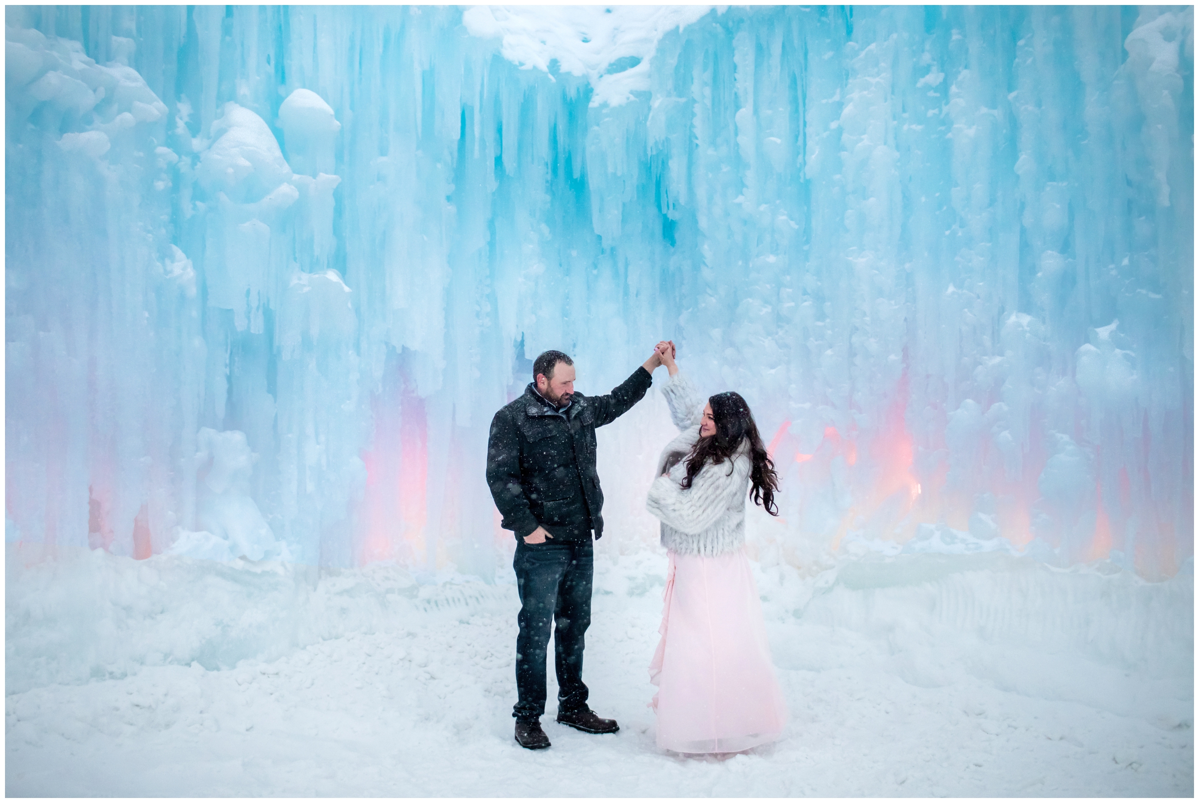 guy spinning fiance during Colorado ice castles engagement pictures by Breckenridge photographer Plum Pretty Photography
