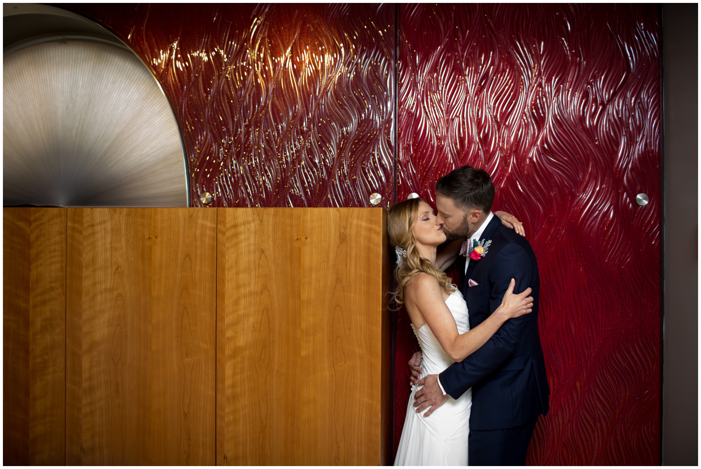 couple kissing during Denver urban city wedding at Denver performing arts complex