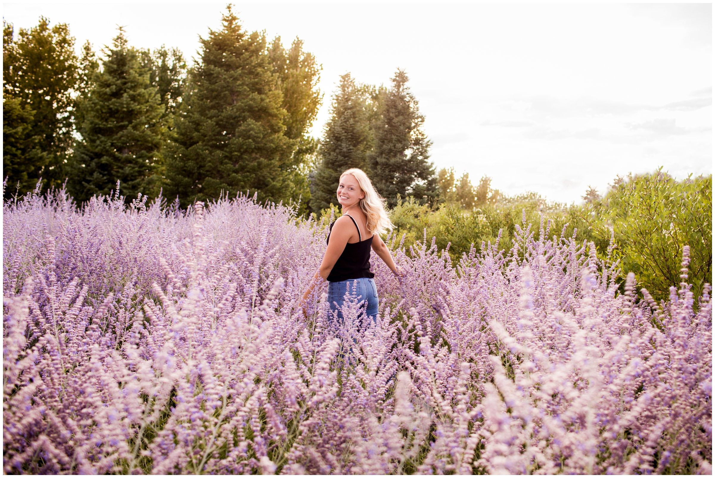 teen girl running through lavender field during Erie Colorado senior portraits by Plum Pretty Photography