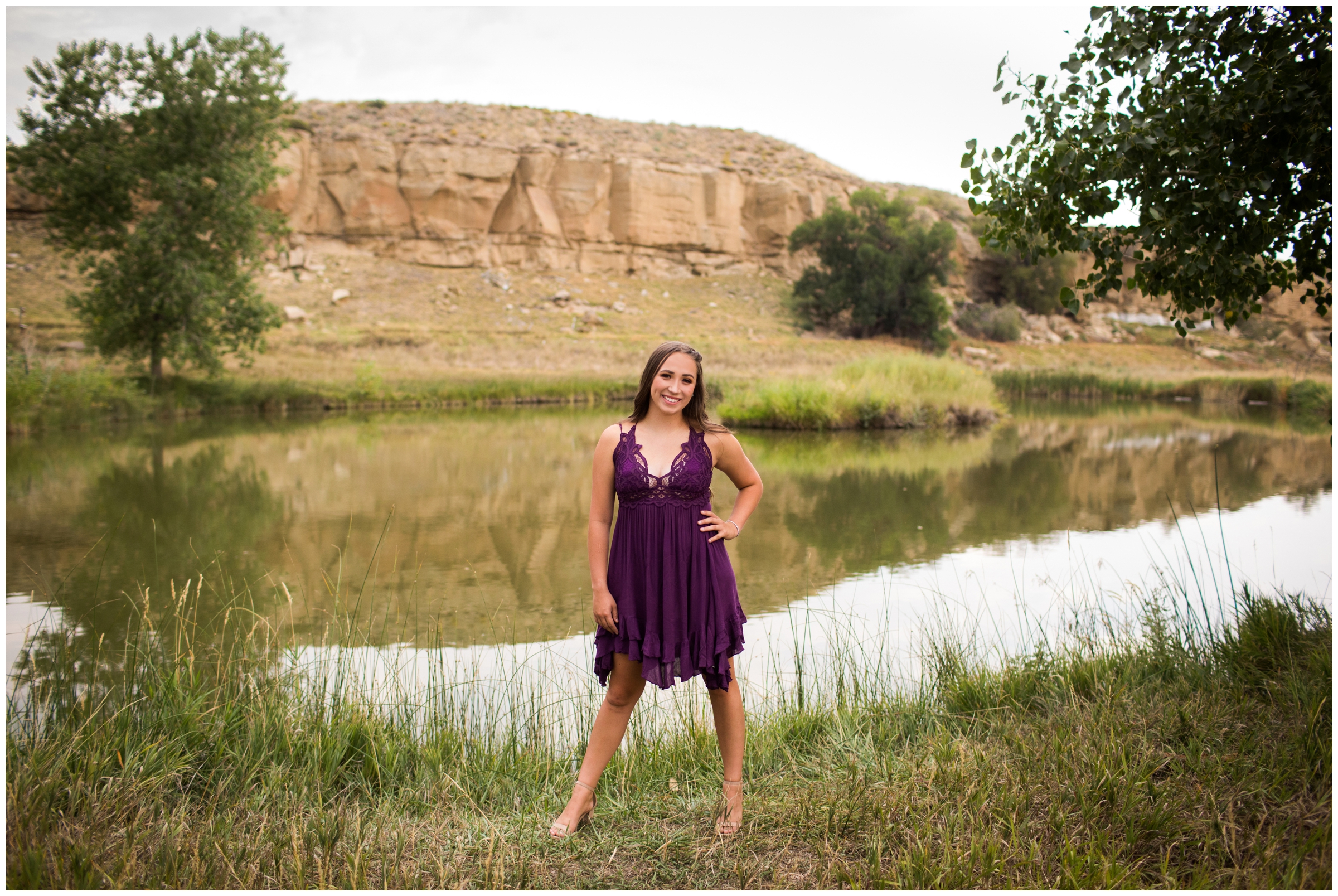teen posing with pond in background during Longmont senior photography session