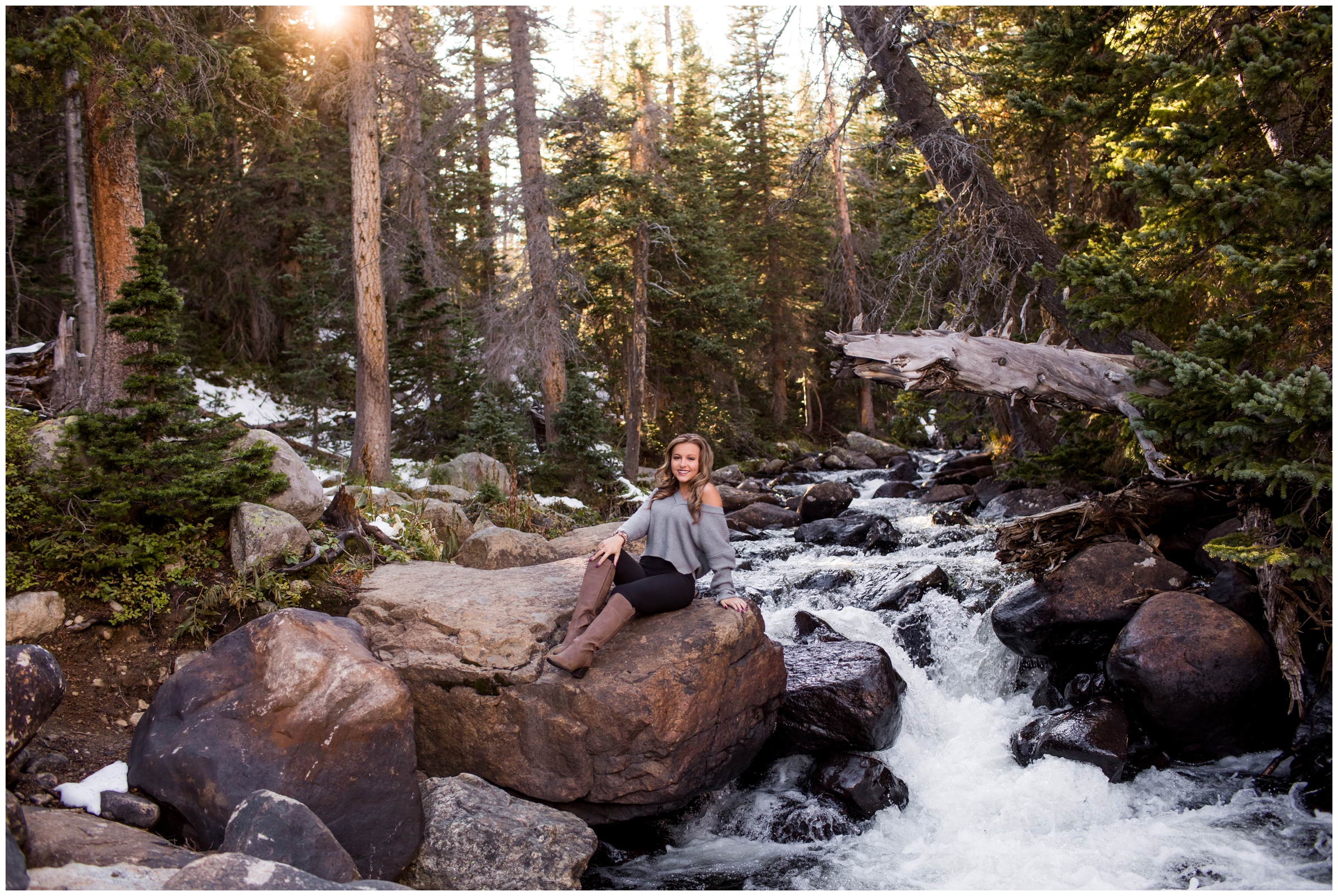 teen posing next to mountain river during Colorado senior portraits 