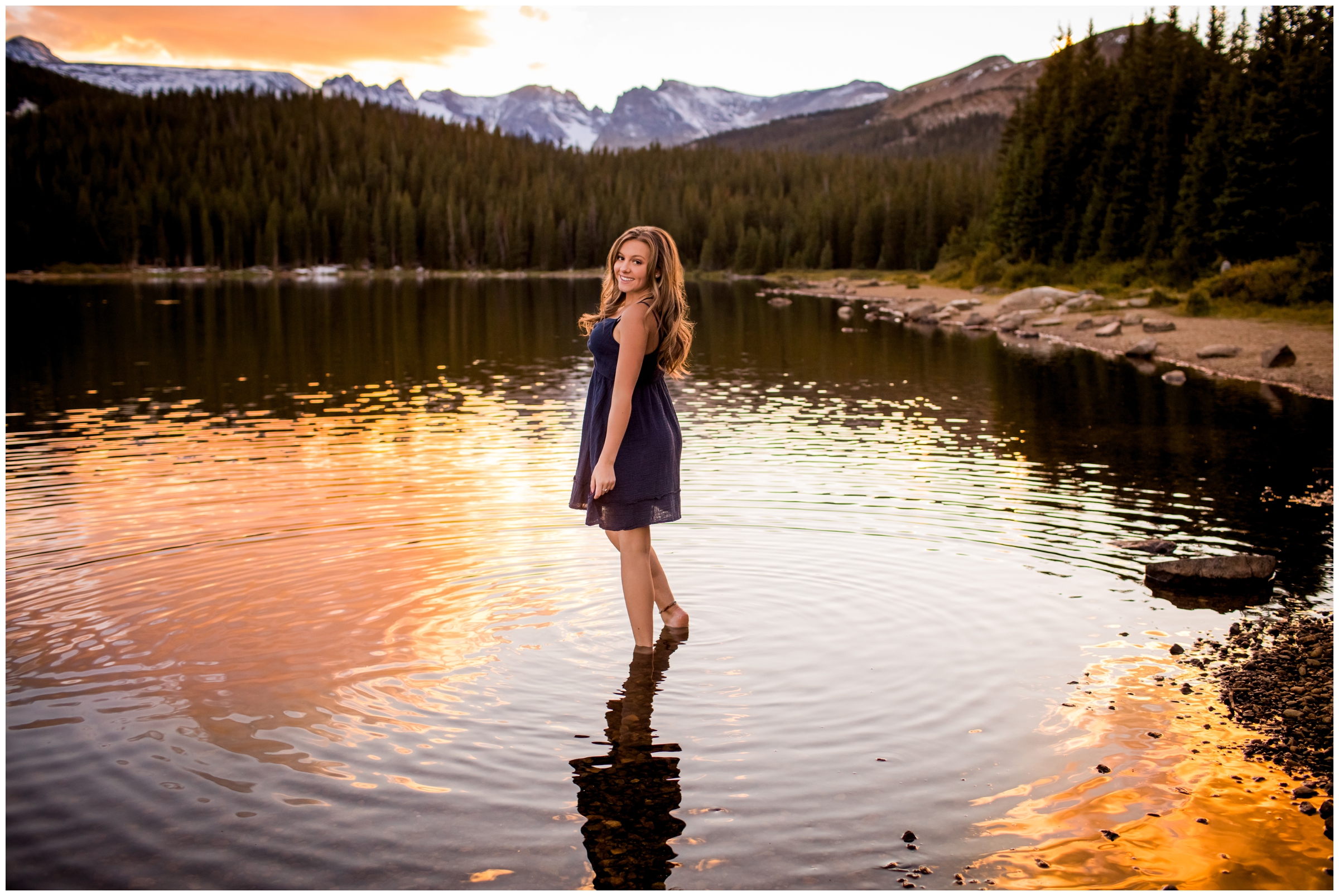 teen girl standing in water during Brainard Lake colorado mountain senior photos