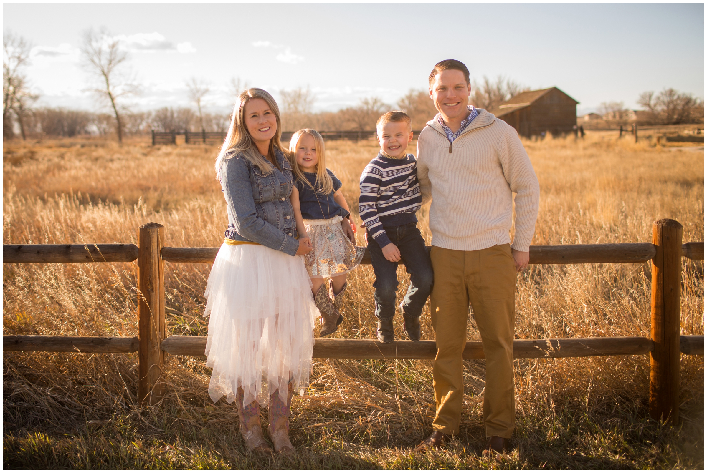 family sitting on fence at Sandstone Ranch during Longmont photography mini session 