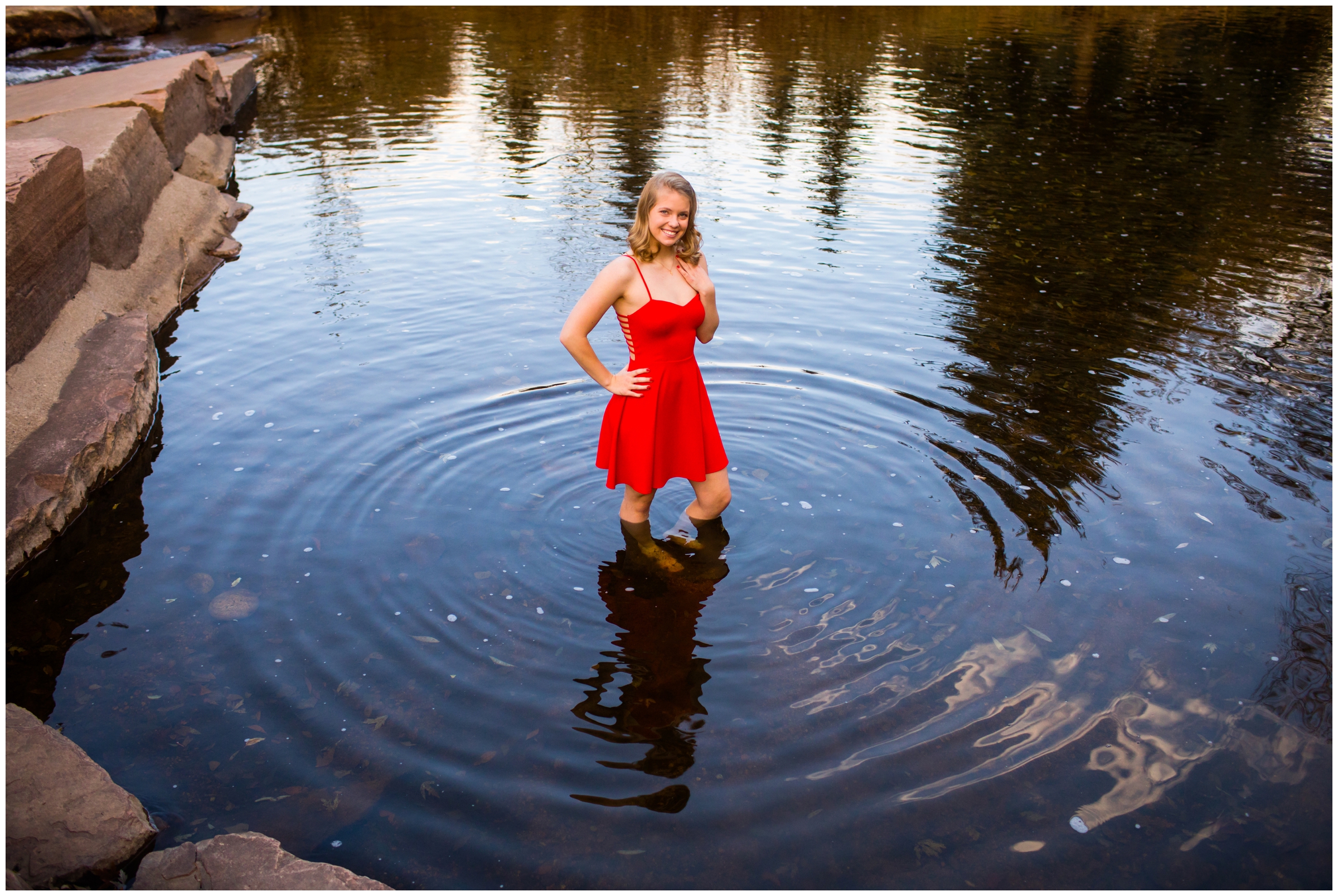 teen posing in river during Estes Park Colorado senior photos 