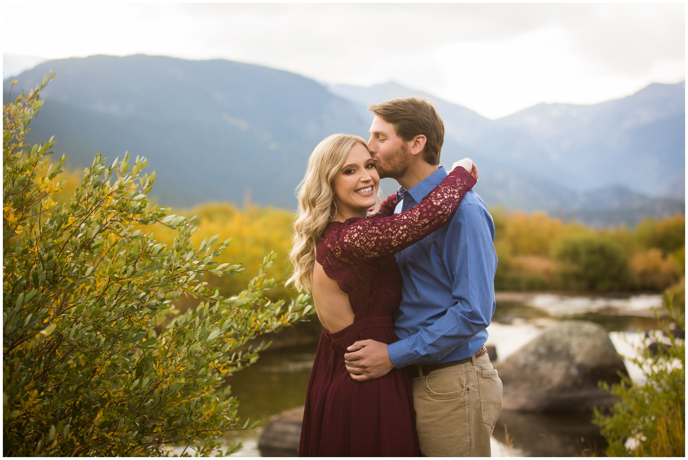 couple kissing at Moraine Park during Estes Park Colorado engagement photos 