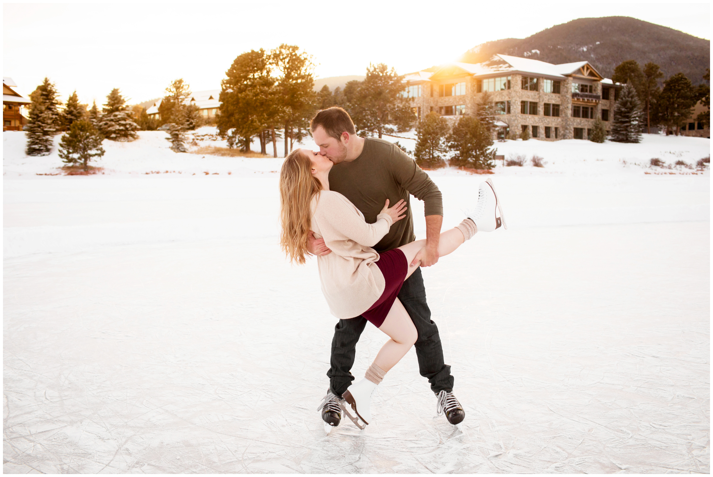 guy dipping girl on ice skates during Evergreen Lake Colorado engagement photos
