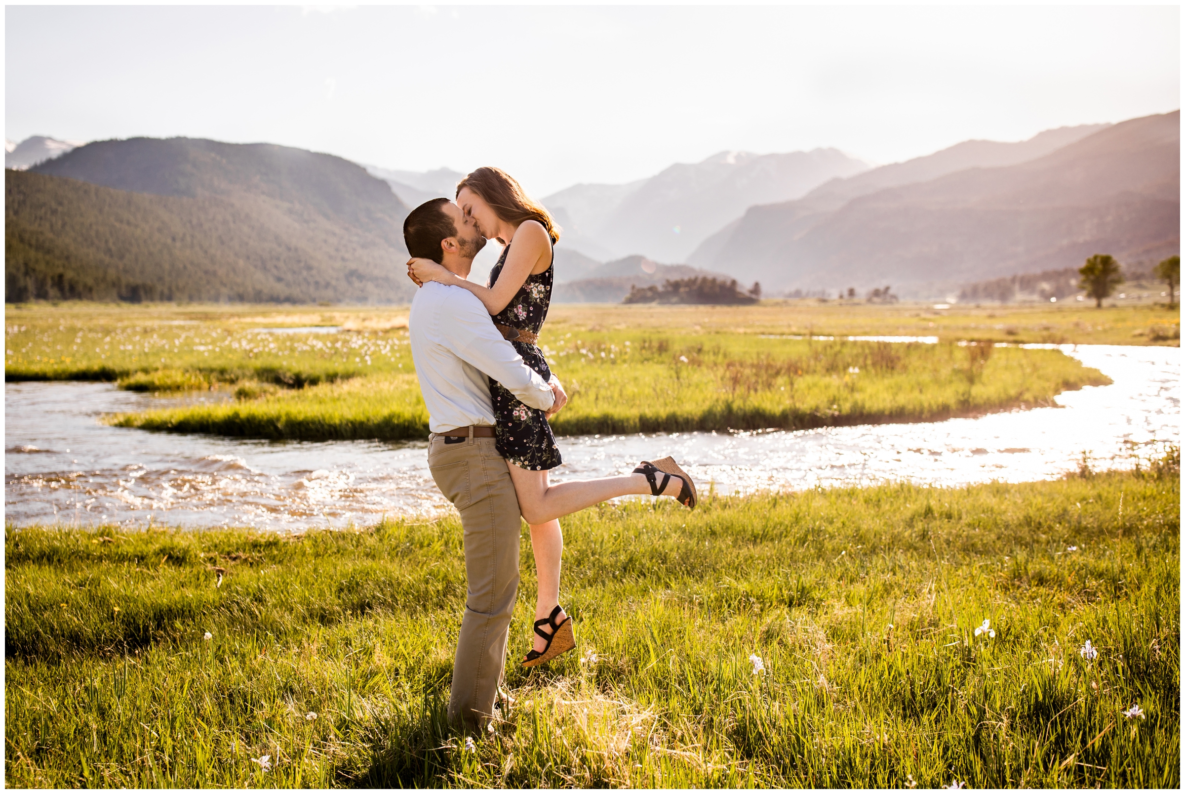 man lifting fiancé during Moraine Park RMNP engagement portraits 