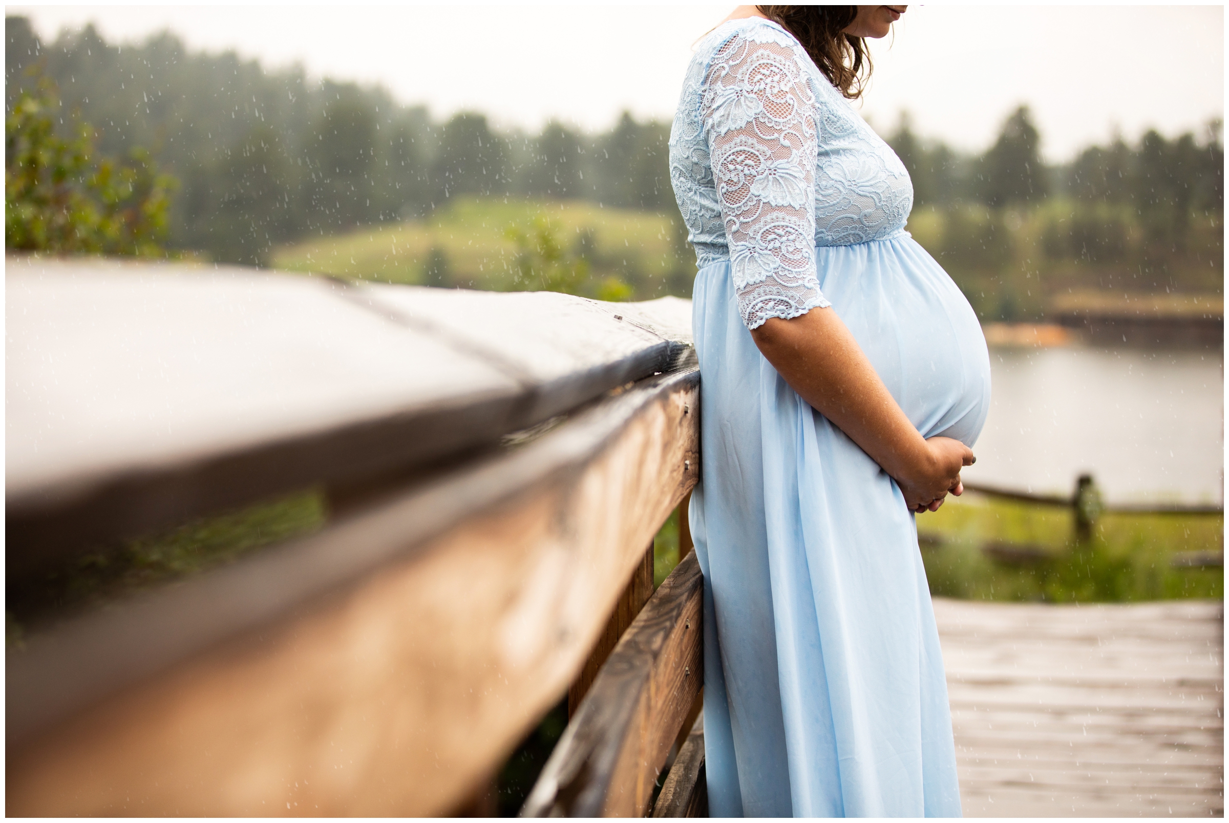 woman in light blue maternity dress during Colorado mountain pregnancy photo session 