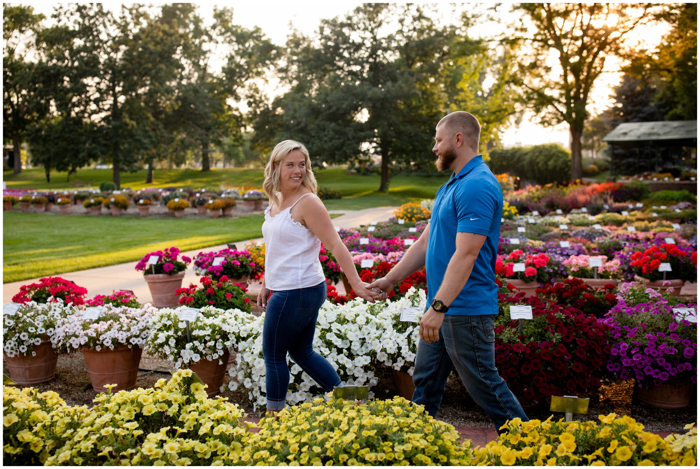 couple walking through CSU trial gardens during engagement pictures 