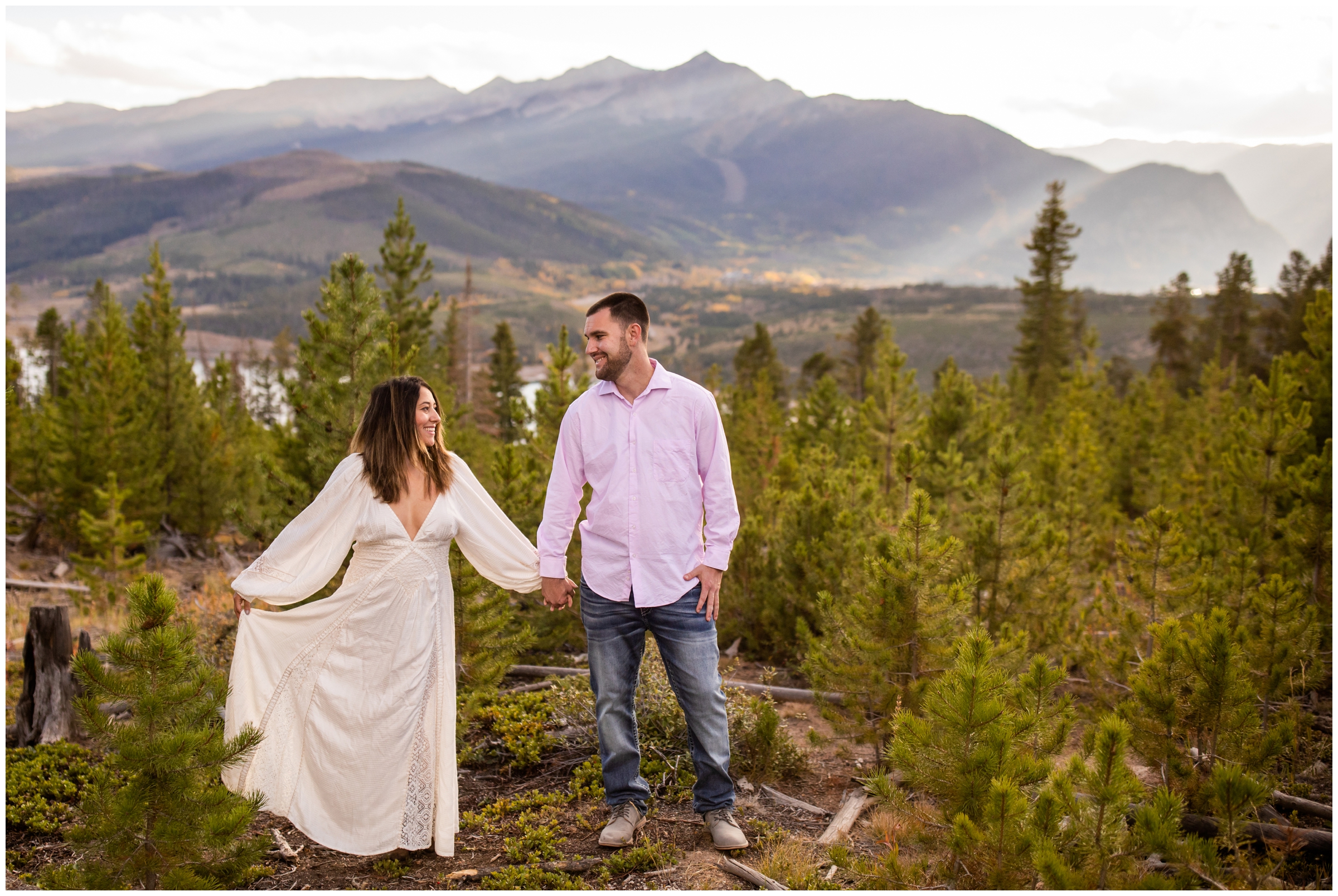 couple holding hands with mountain backdrop at Sapphire Point overlook fall engagement pictures 