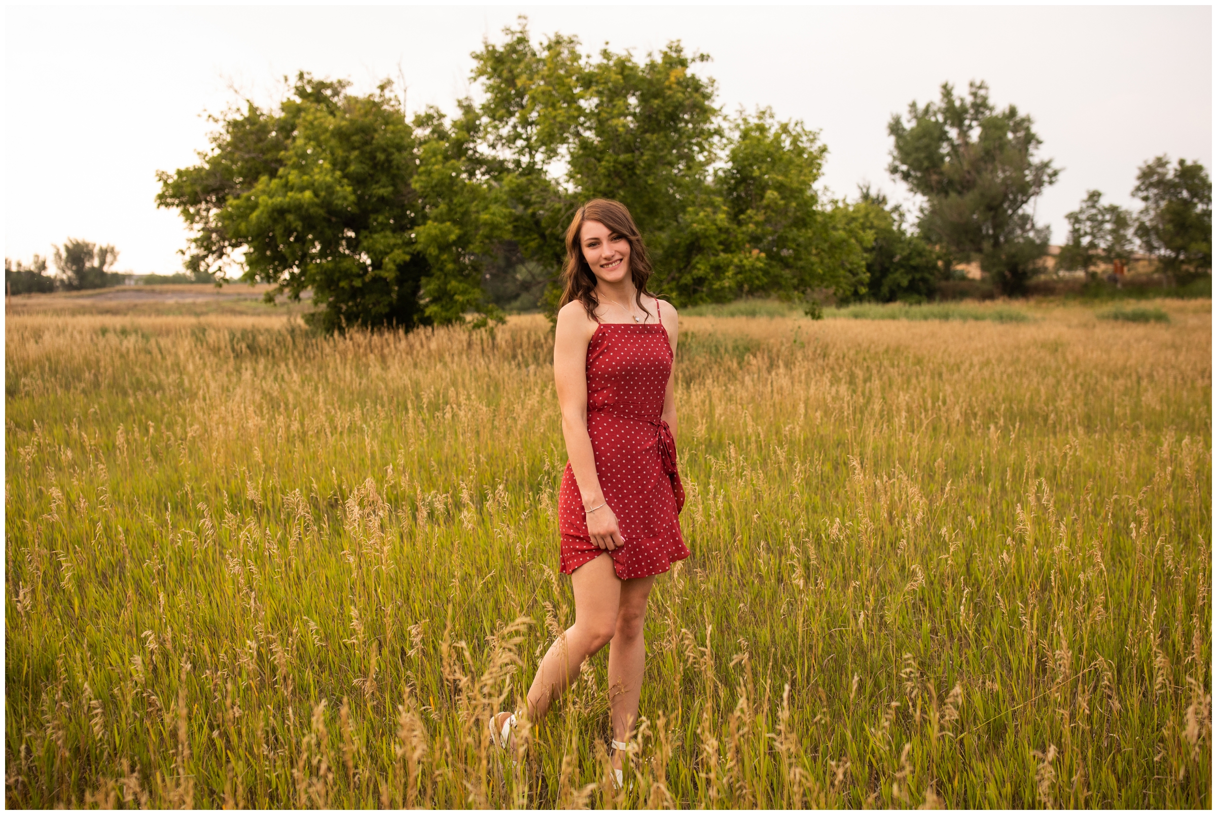 Teen spinning in a field during sandstone Ranch Longmont senior pictures 