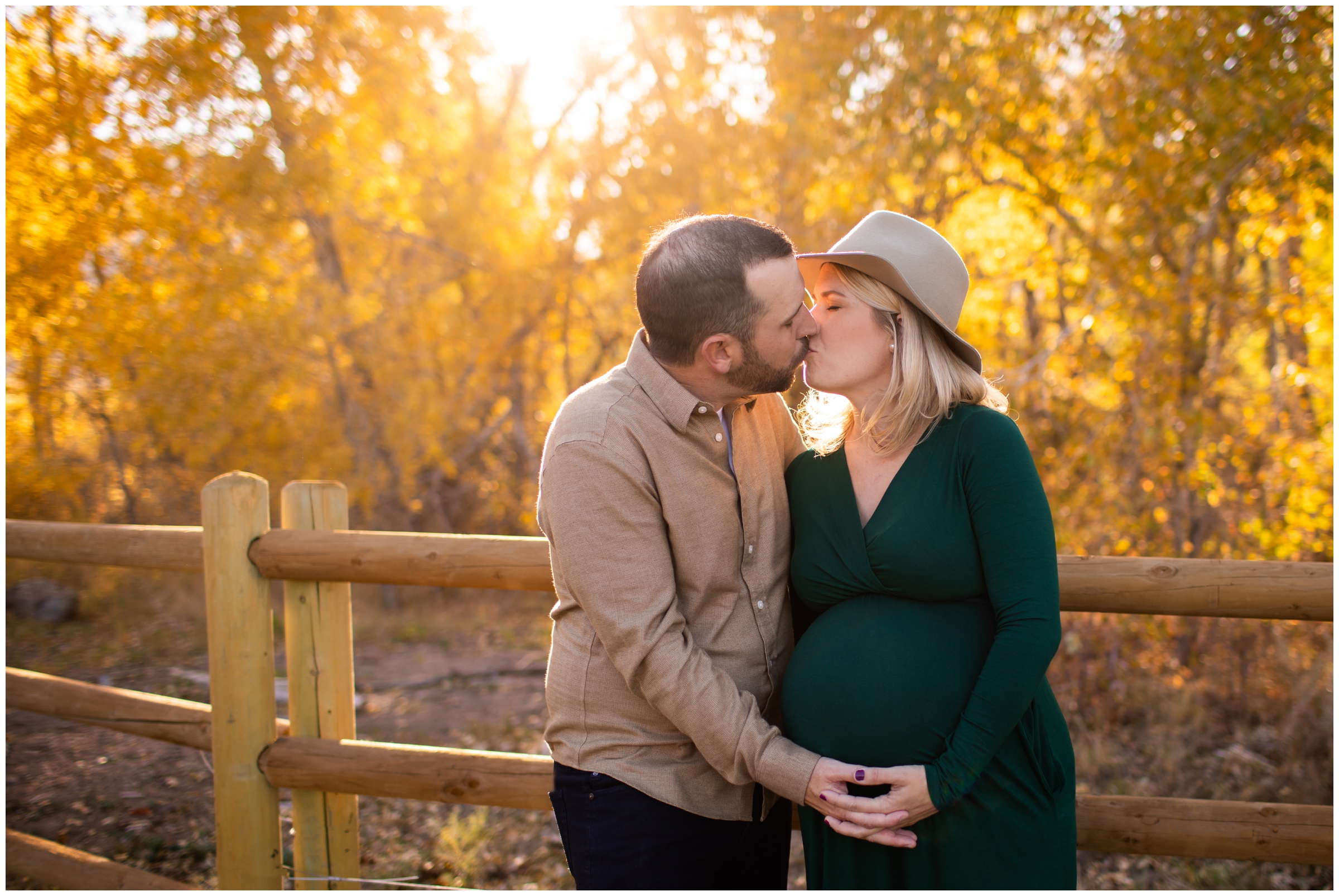 couple kissing during Boulder maternity portraits at South Mesa Trail by Colorado photographer Plum Pretty Photography