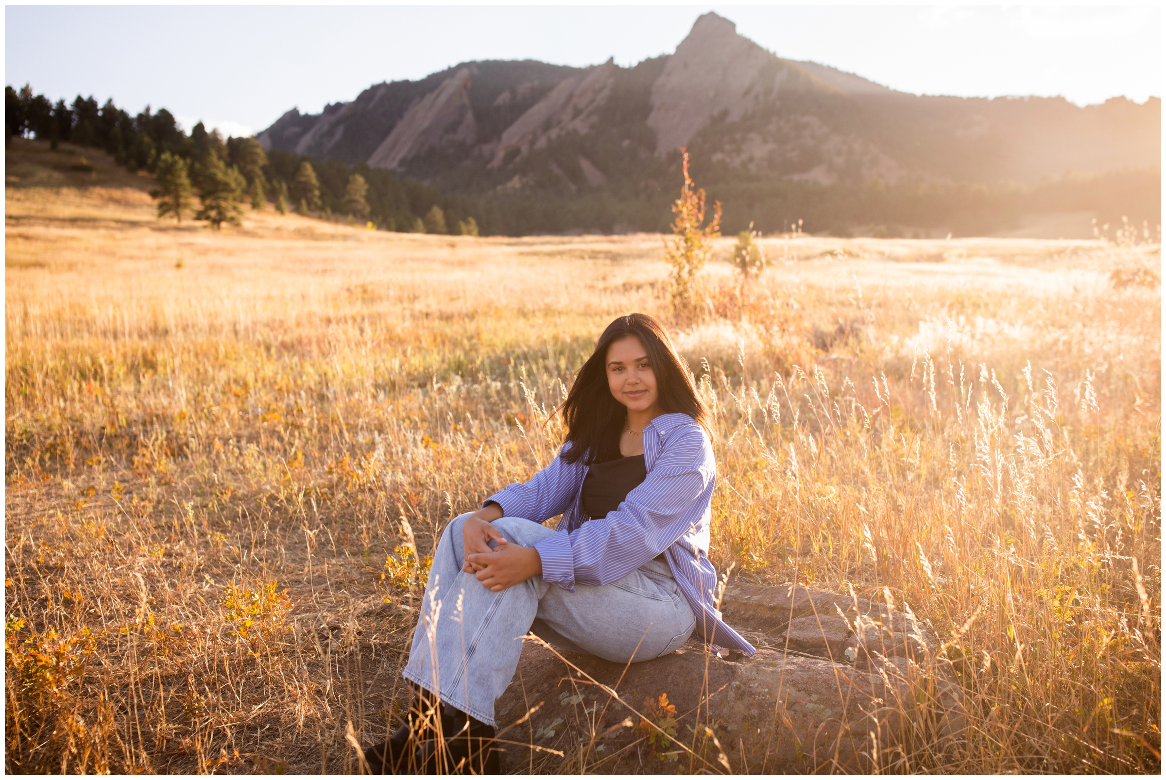 teen posing in a field during Boulder Colorado high school senior photography session 