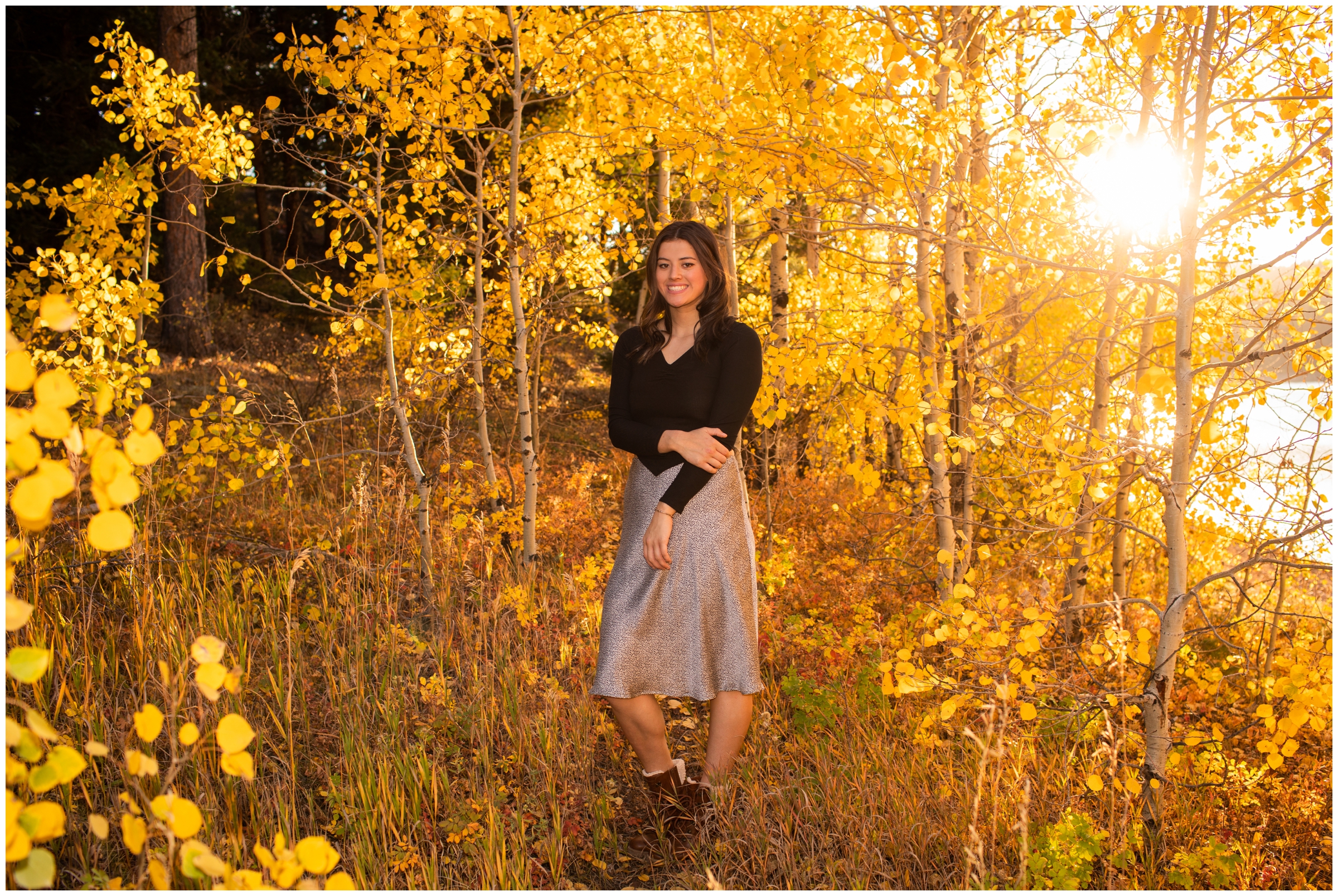 teen posing in an aspen grove during fall Boulder Colorado senior pictures 