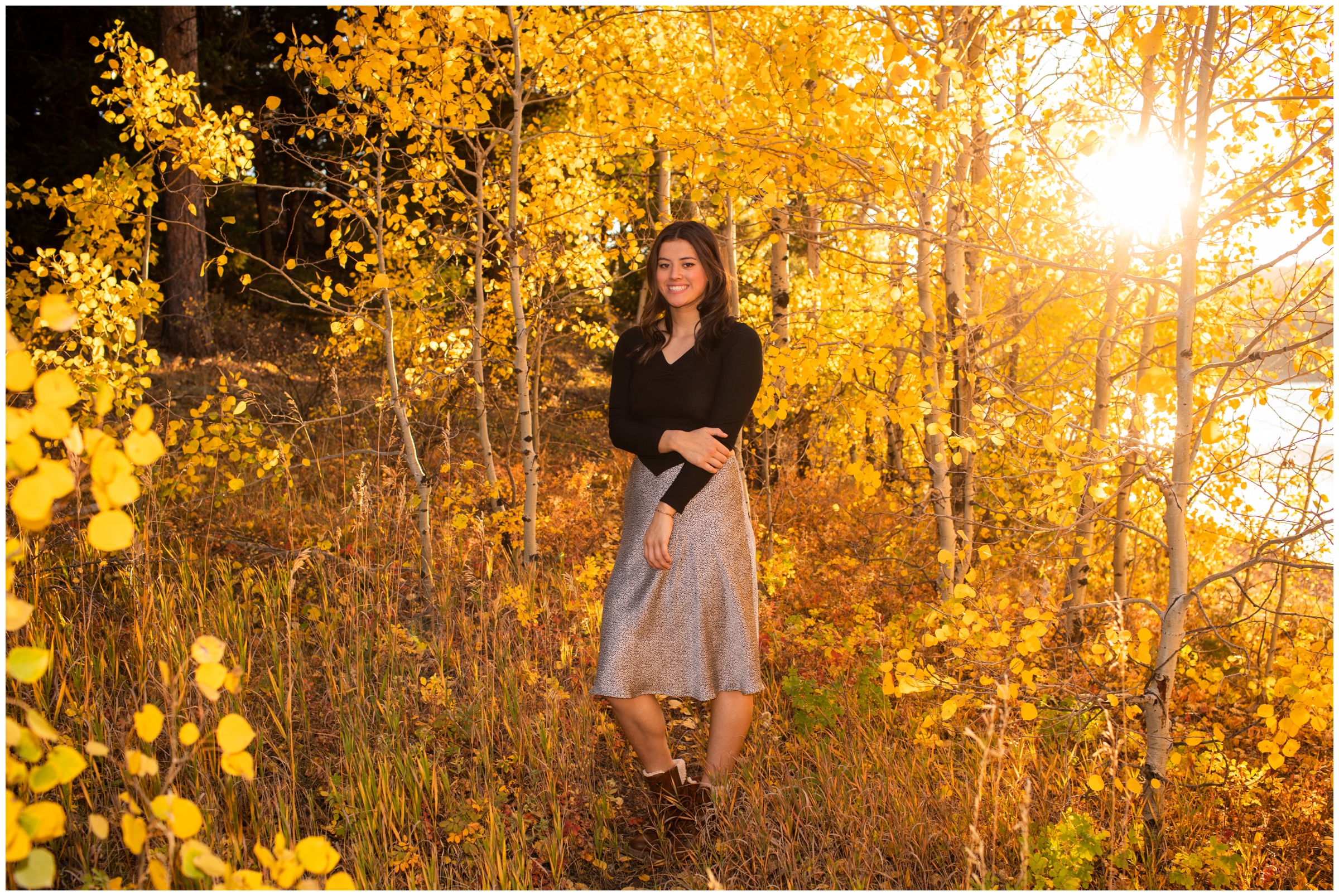 teen posing in an aspen grove during fall Boulder Colorado senior pictures
