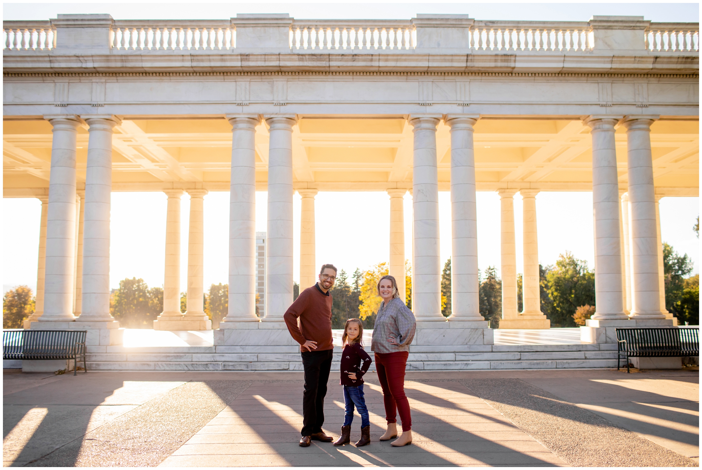 family posing in front of pavilion at Cheesman Park during Denver family portraits by Colorado photographer Plum Pretty Photography 
