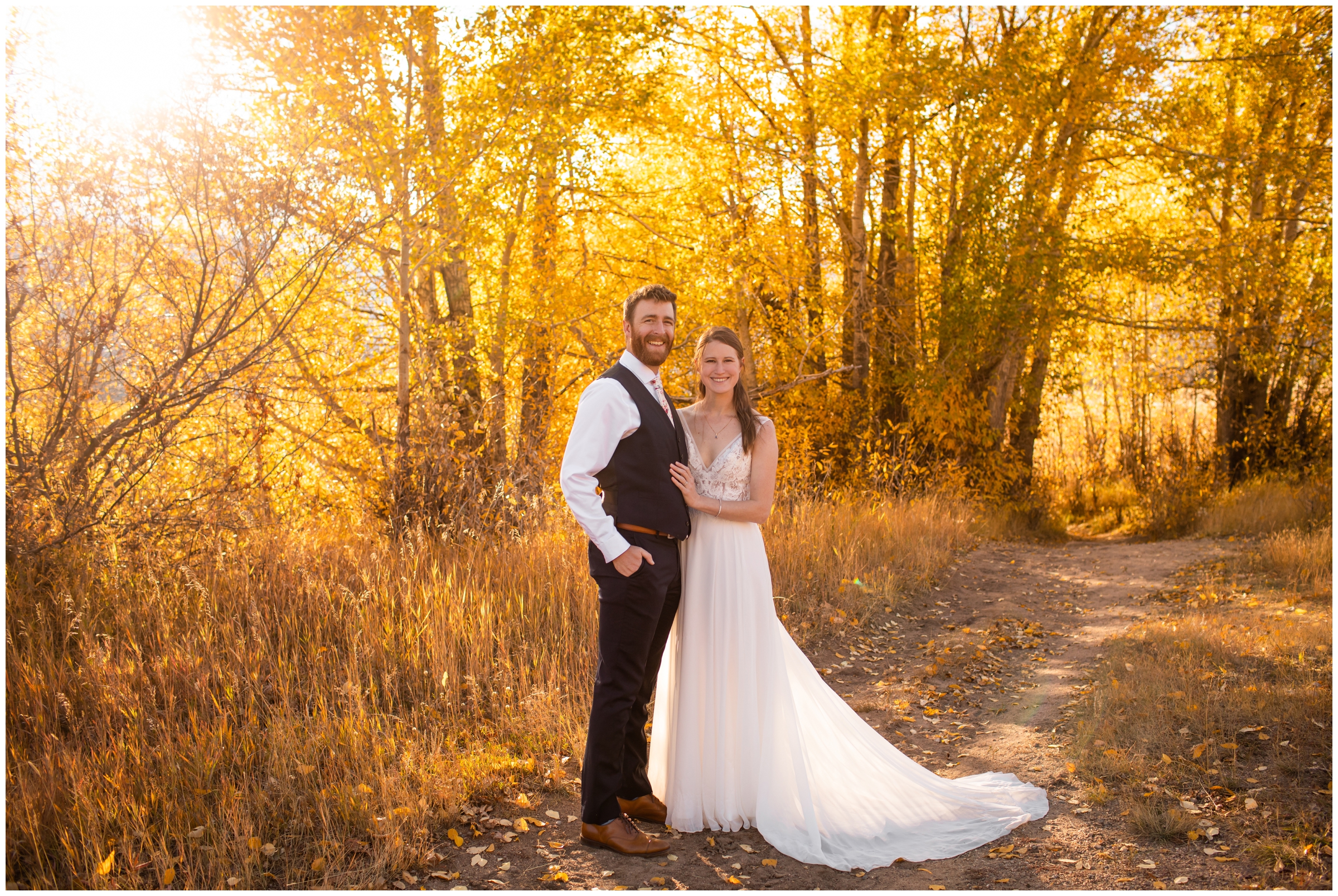 couple posing in front of colorful fall foliage at Colorado elopement in Rocky Mountain National Park 