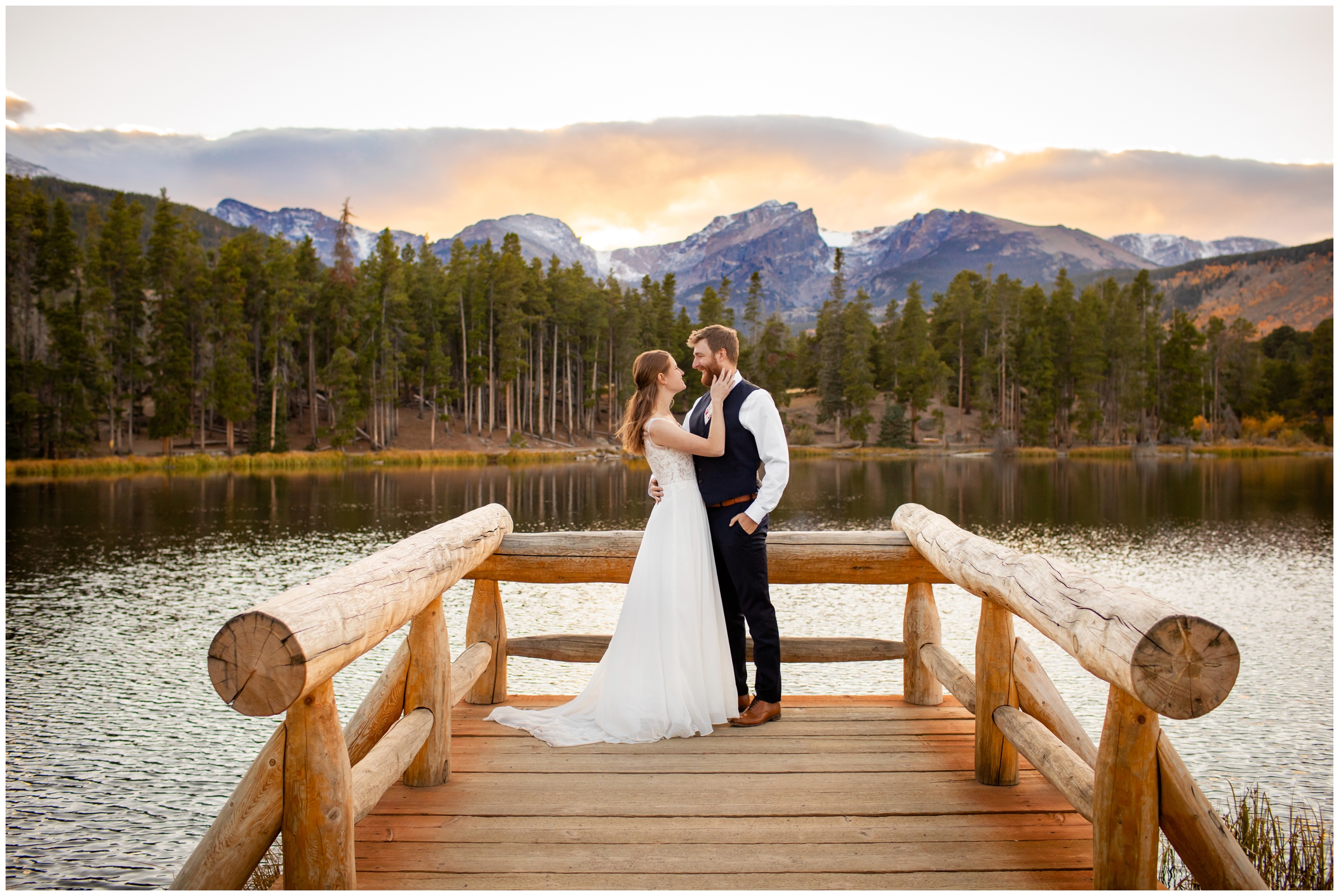 couple posing on a wooden dock during RMNP wedding photos at Sprague Lake 