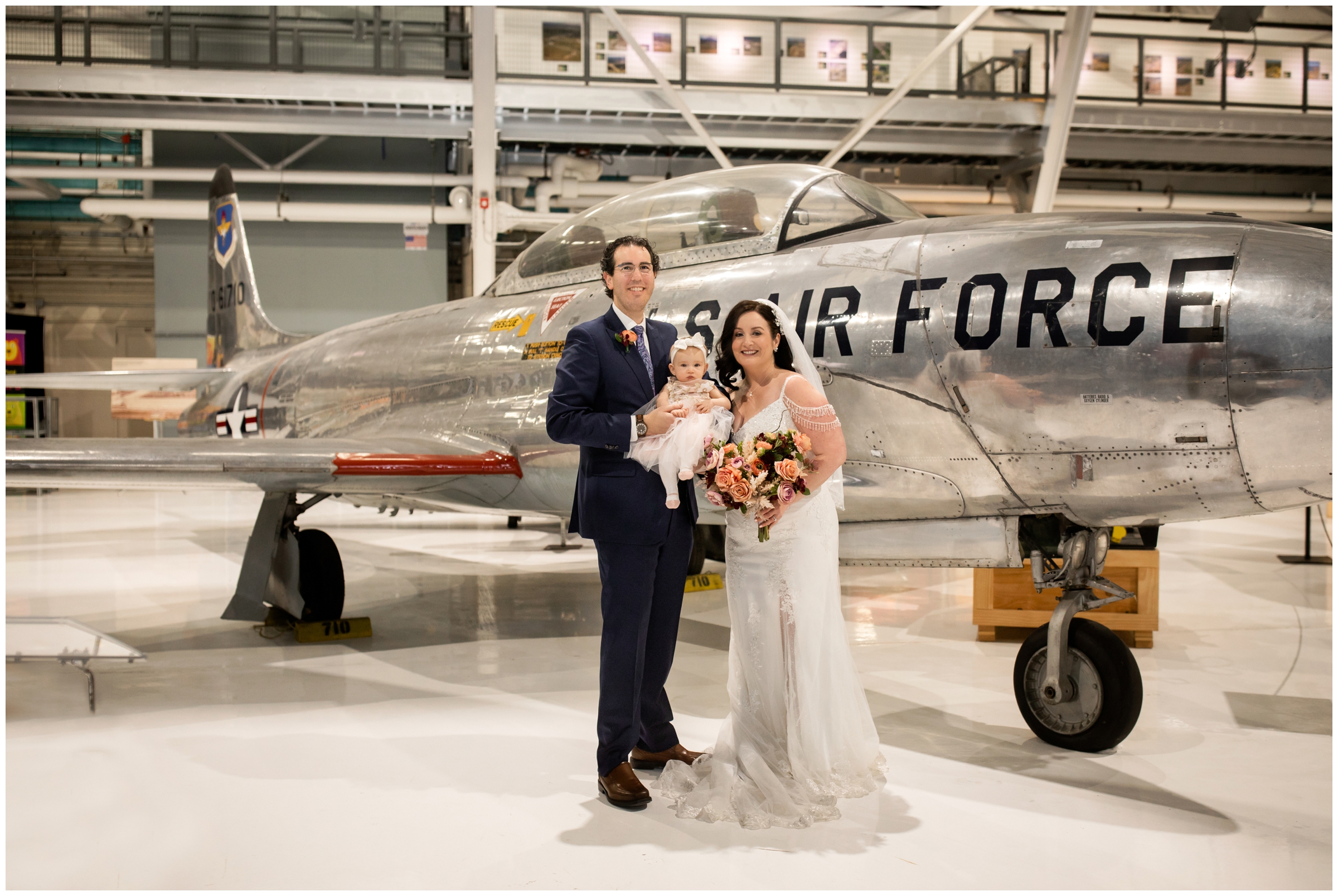 bride and groom with baby daughter during Denver museum wedding portraits 