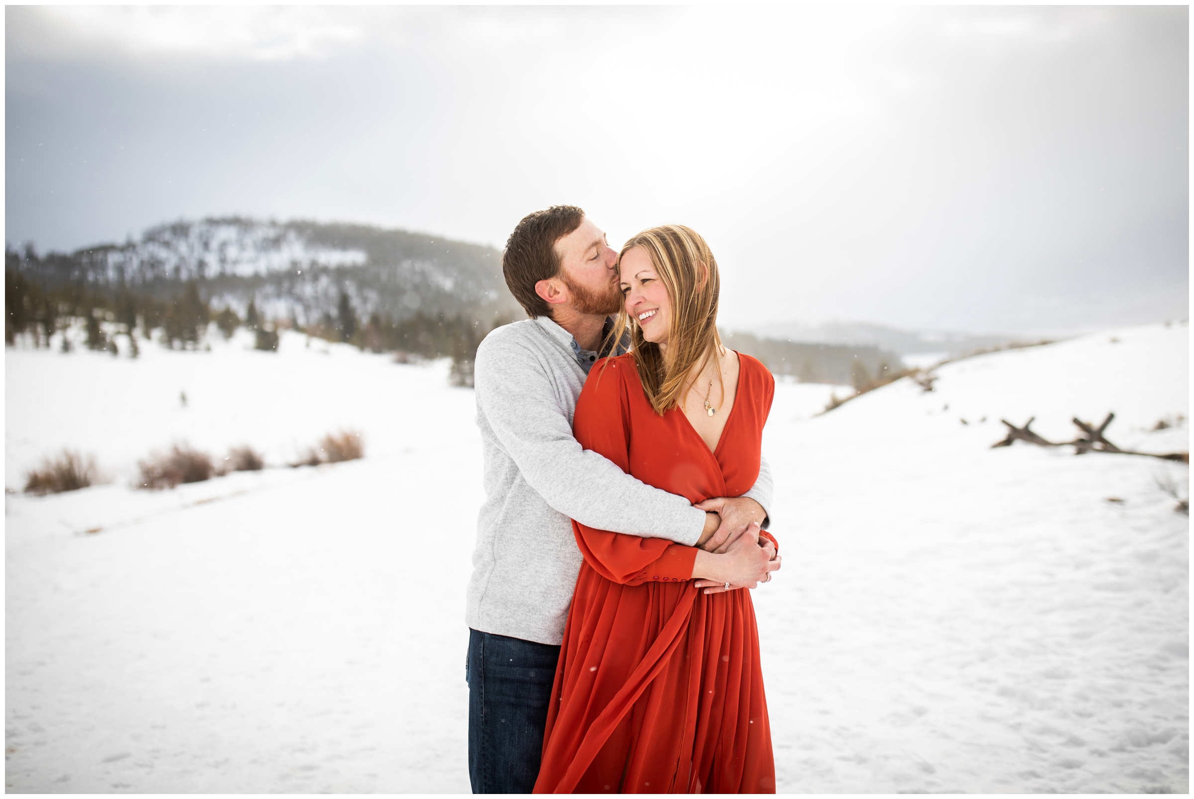 couple cuddling in the snow during Breckenridge winter couple's portraits 
