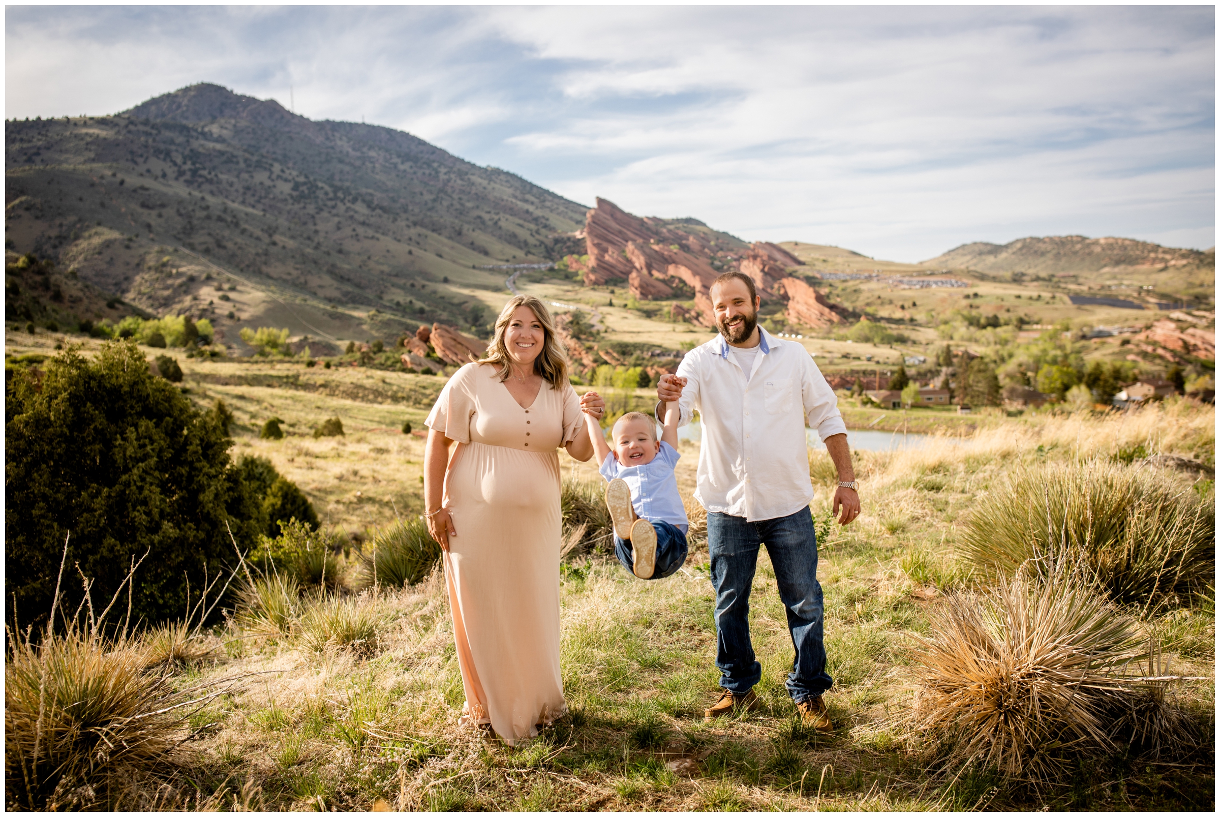 parents swinging son during candid family photos at Mount Falcon in Morrison Colorado 