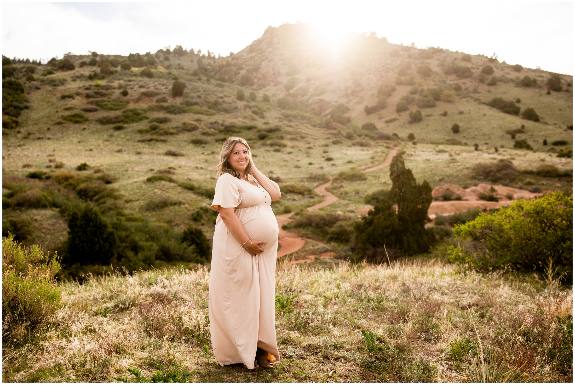 pregnant woman posing in the mountains during Mount Falcon East maternity portraits 