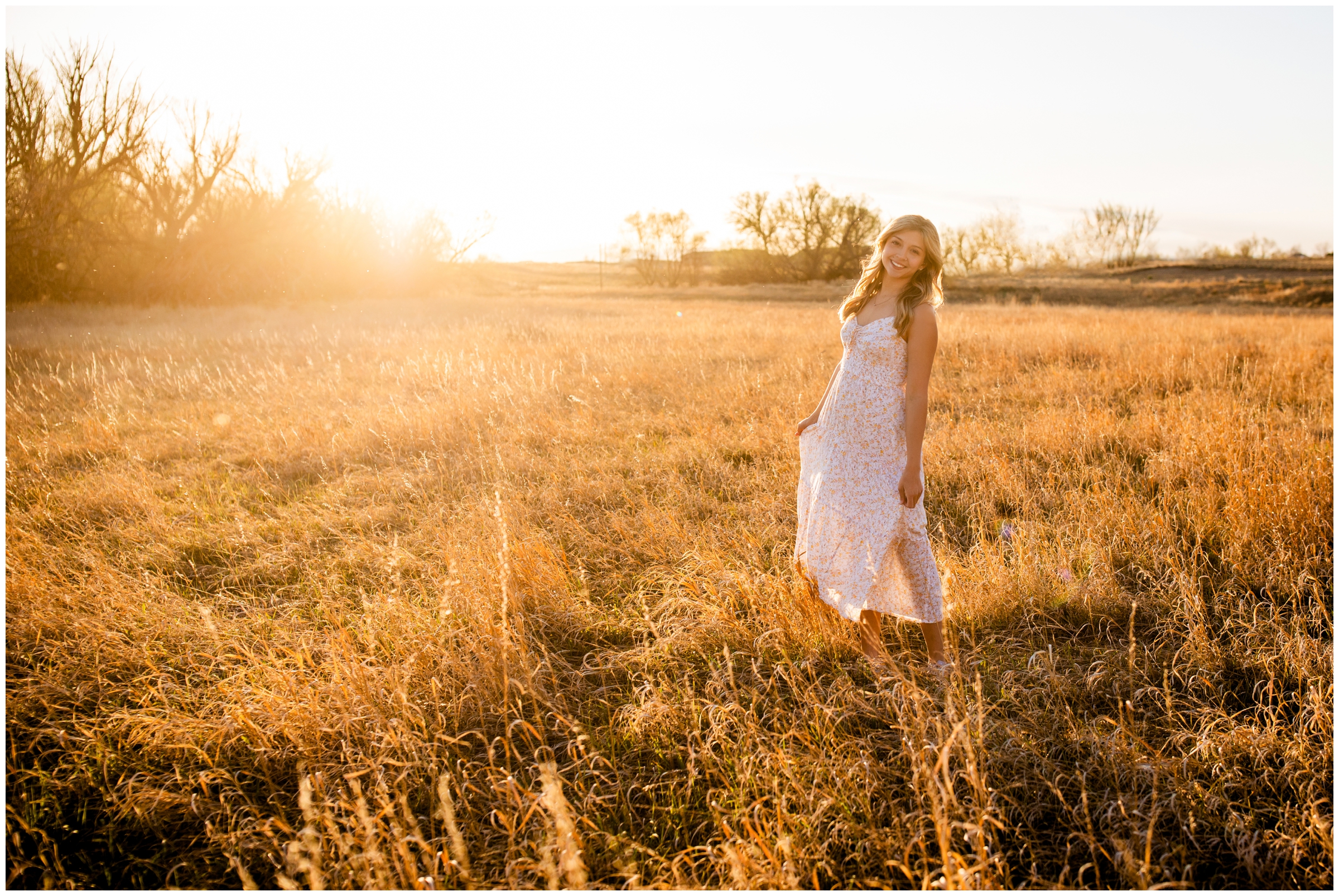 teen girl twirling in a field during sunny golden hour senior photography session in Longmont Colorado 