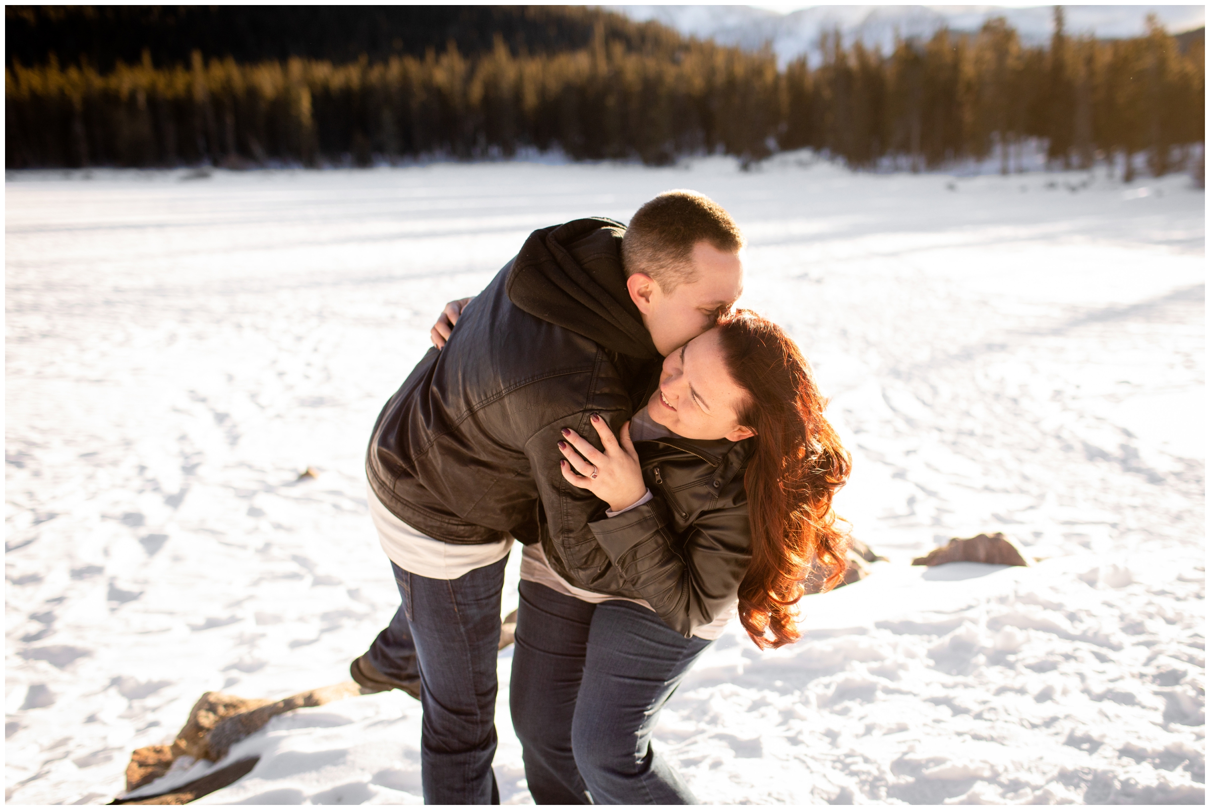 couple laughing during candid engagement pictures in the Colorado mountains at Echo Lake