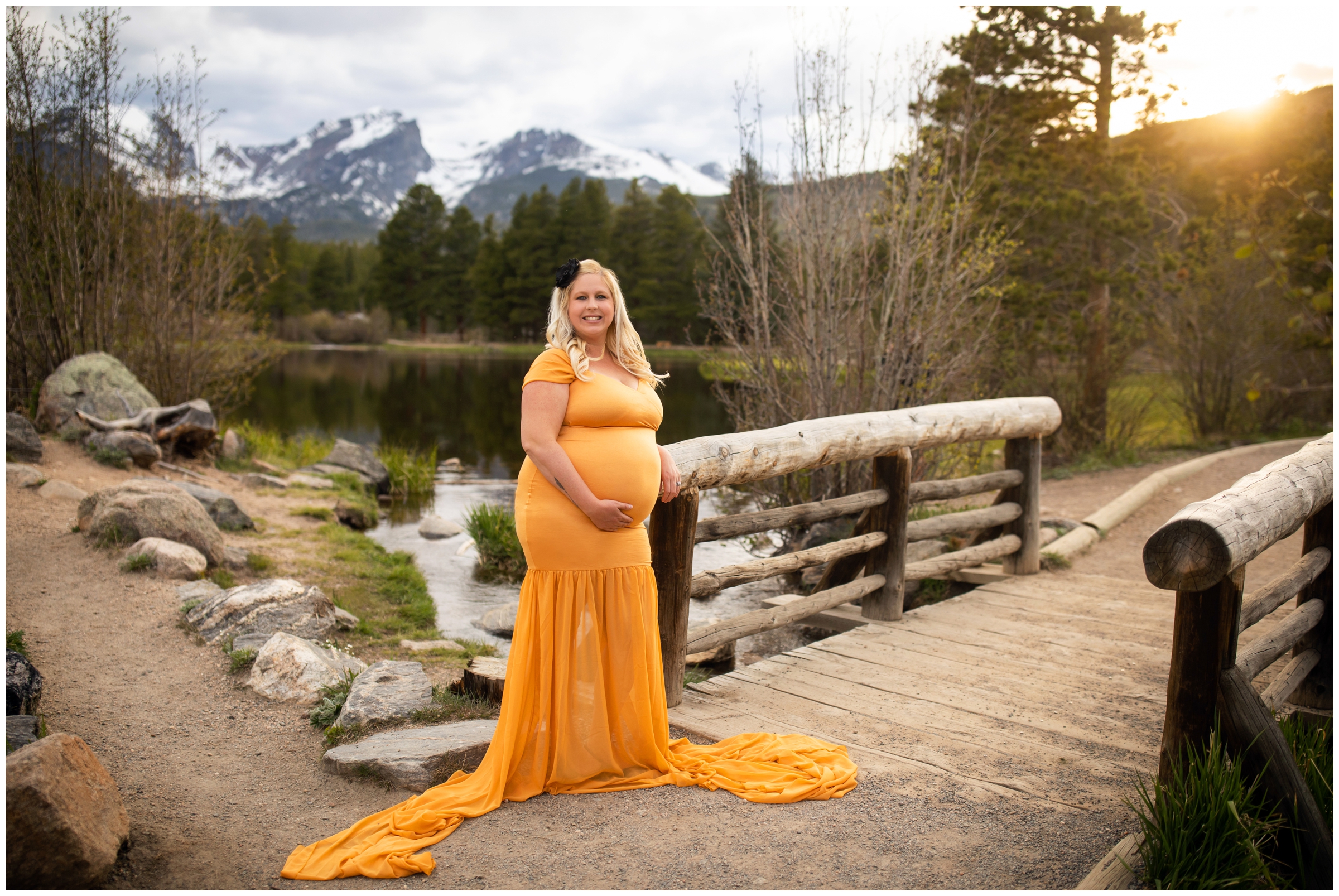 pregnant woman posing on wooden bridge at Sprague Lake during Colorado mountain maternity portraits 