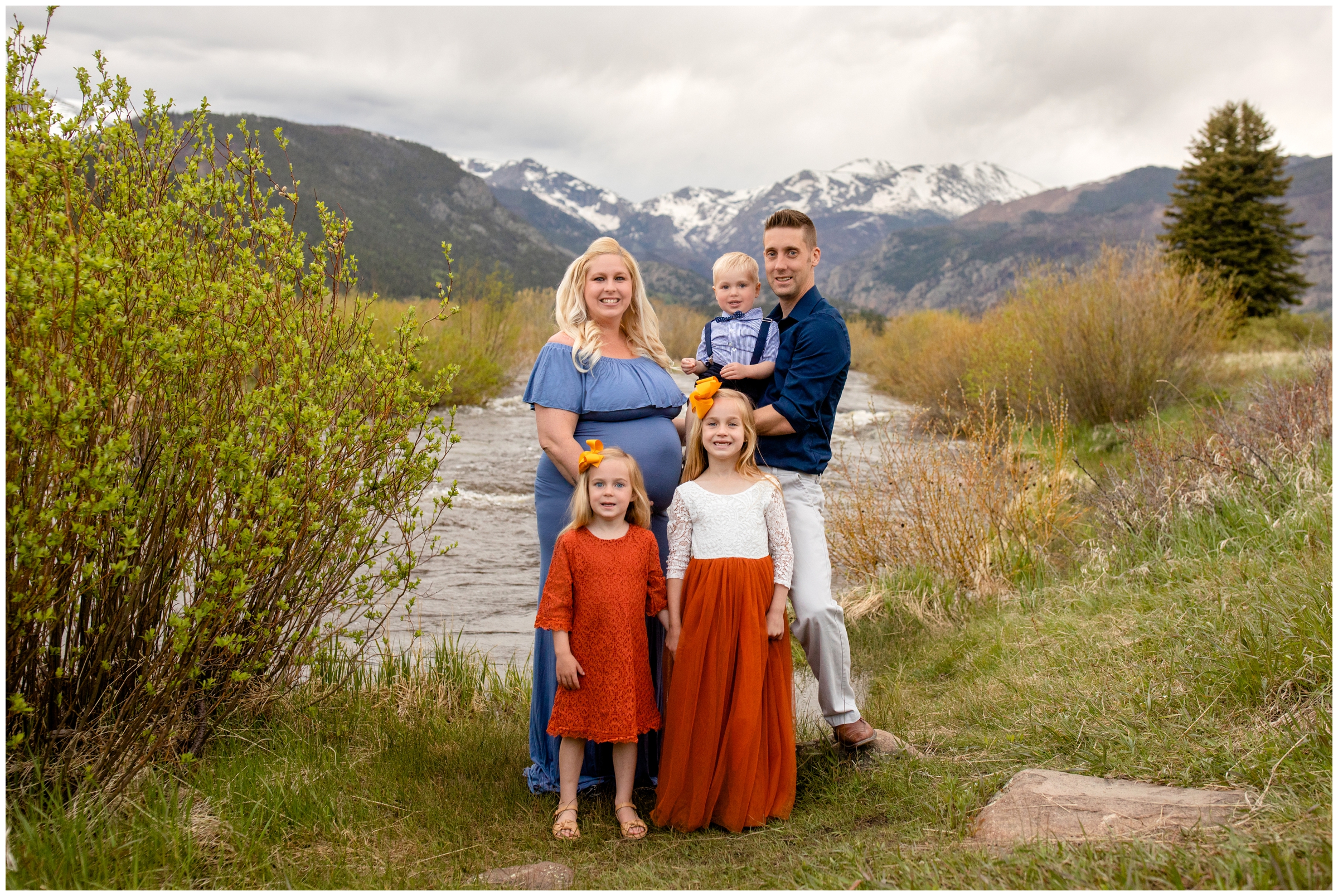 family of five posing by the river in Moraine Park during Colorado mountain family portraits 
