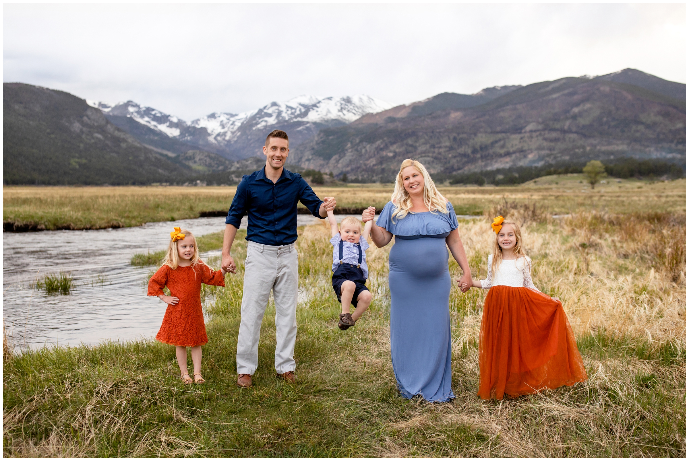 parents swinging little boy during candid family photos in Estes Park Colorado 