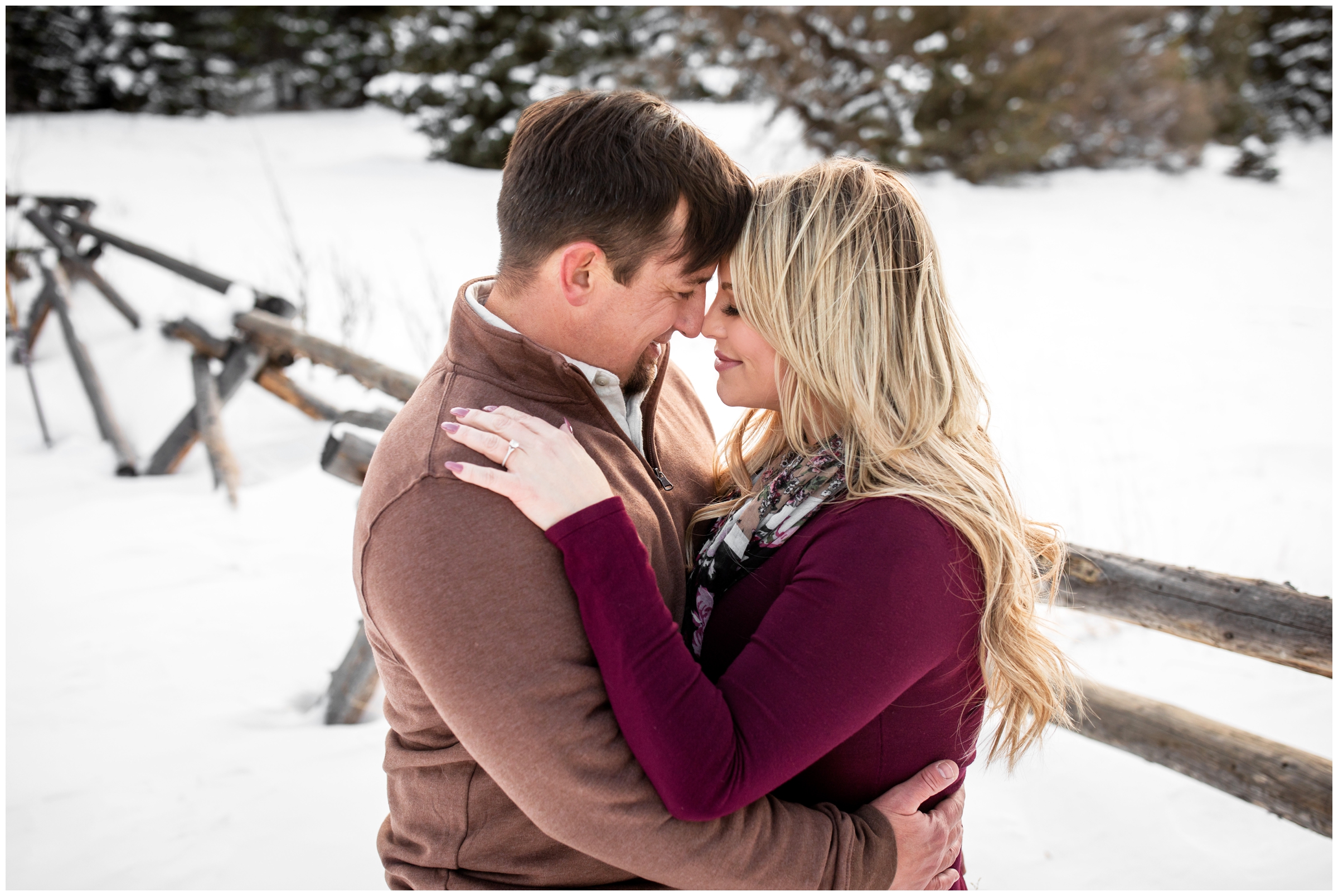 snowy couple's portraits in Colorado mountains at Frosberg Park in Evergreen