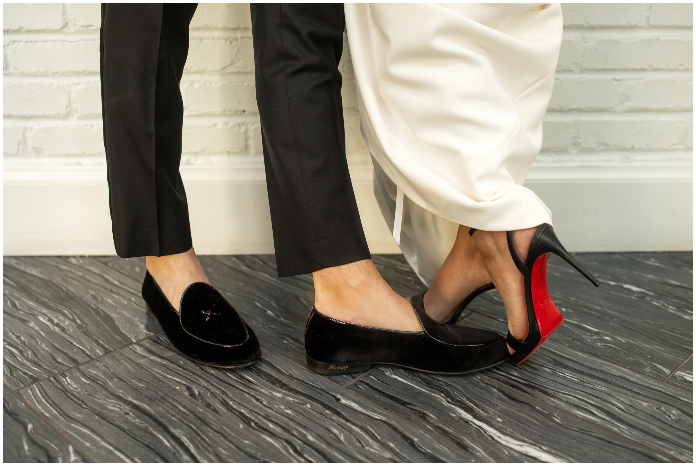 bride and groom in Christian Louboutin wedding shoes