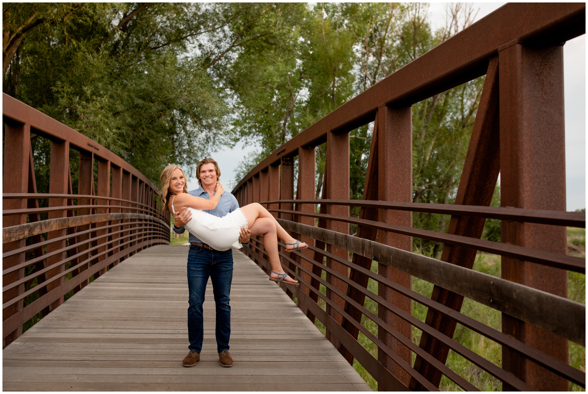 man holding fiancé during Colorado summer engagement pictures at Sandstone Ranch 