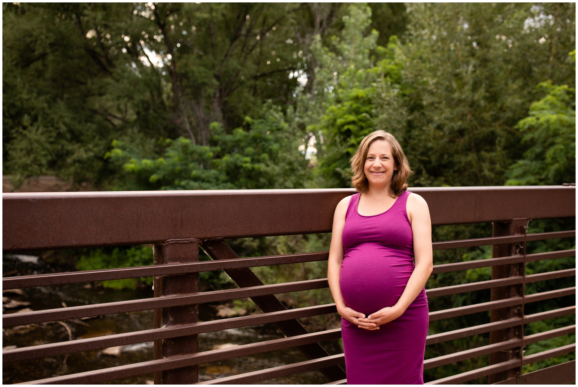 pregnant woman posing on a bridge at Golden Ponds Nature Area during Colorado maternity photography session 