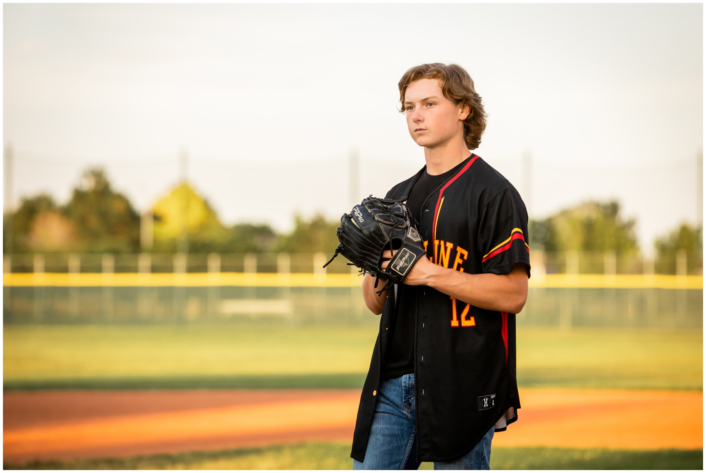 Skyline High School baseball player on pitching mound during Longmont Colorado senior photography session