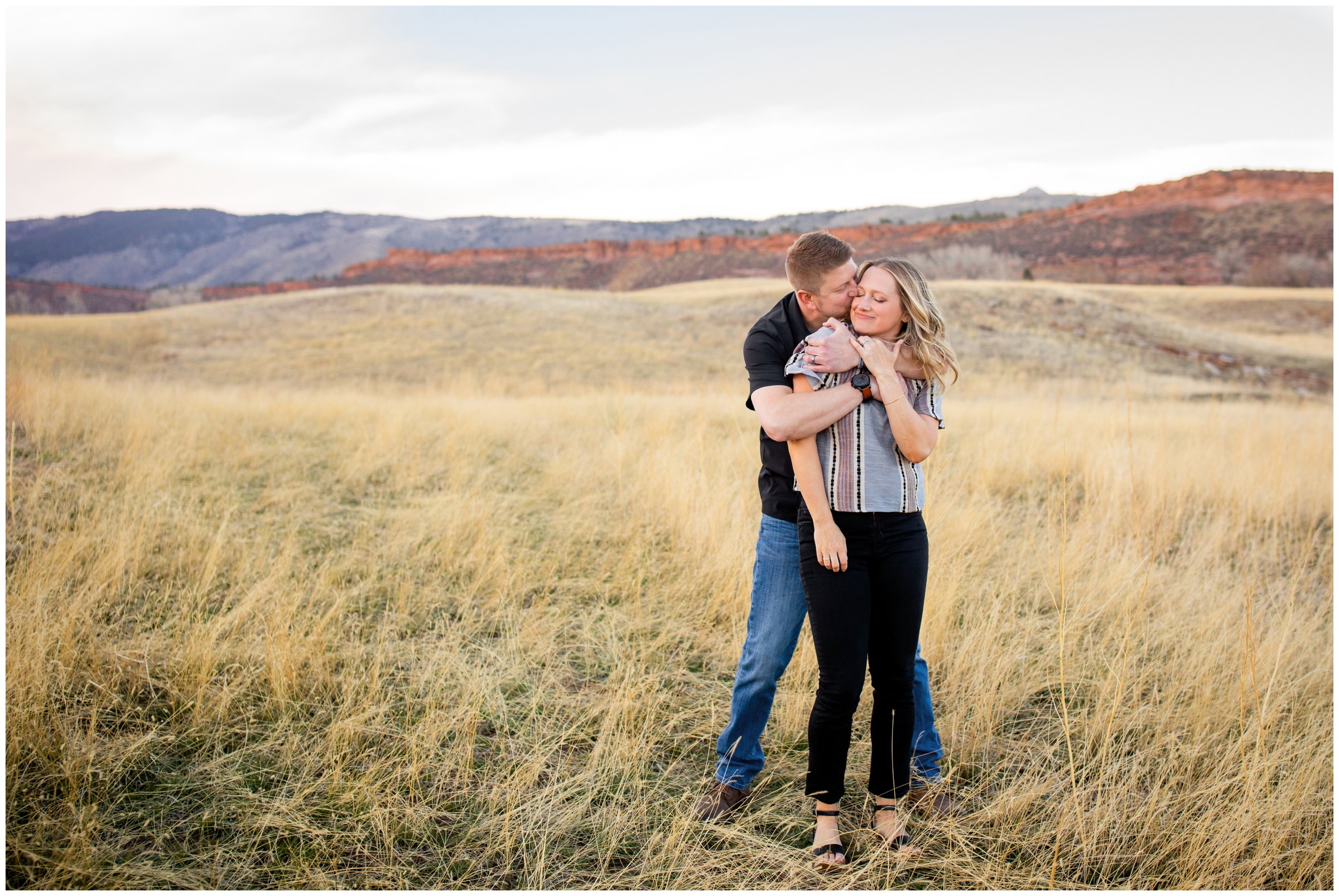 couple embracing during spring engagement pictures in Fort Collins
