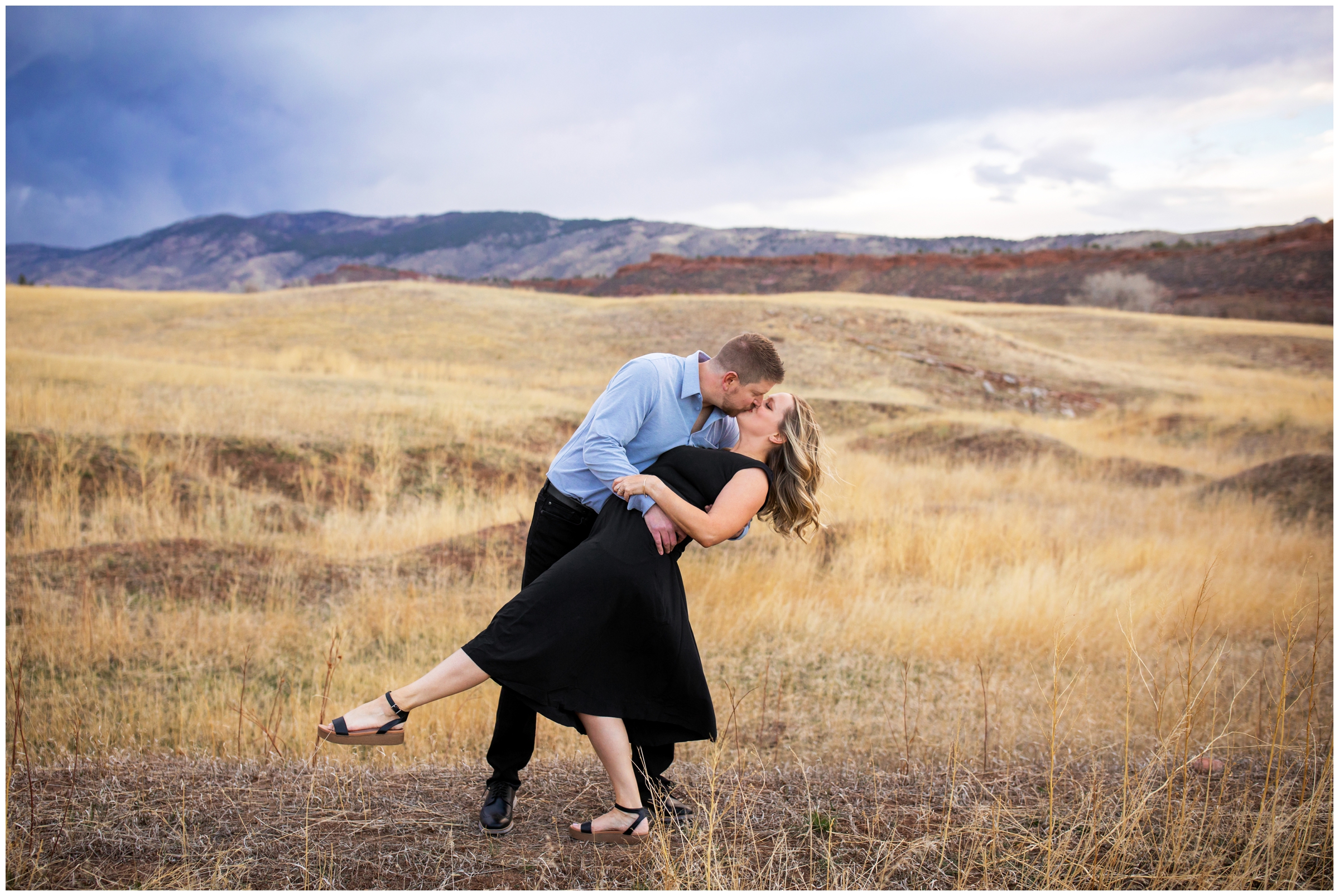 husband dipping wife during Loveland Colorado couples portraits at bobcat ridge 
